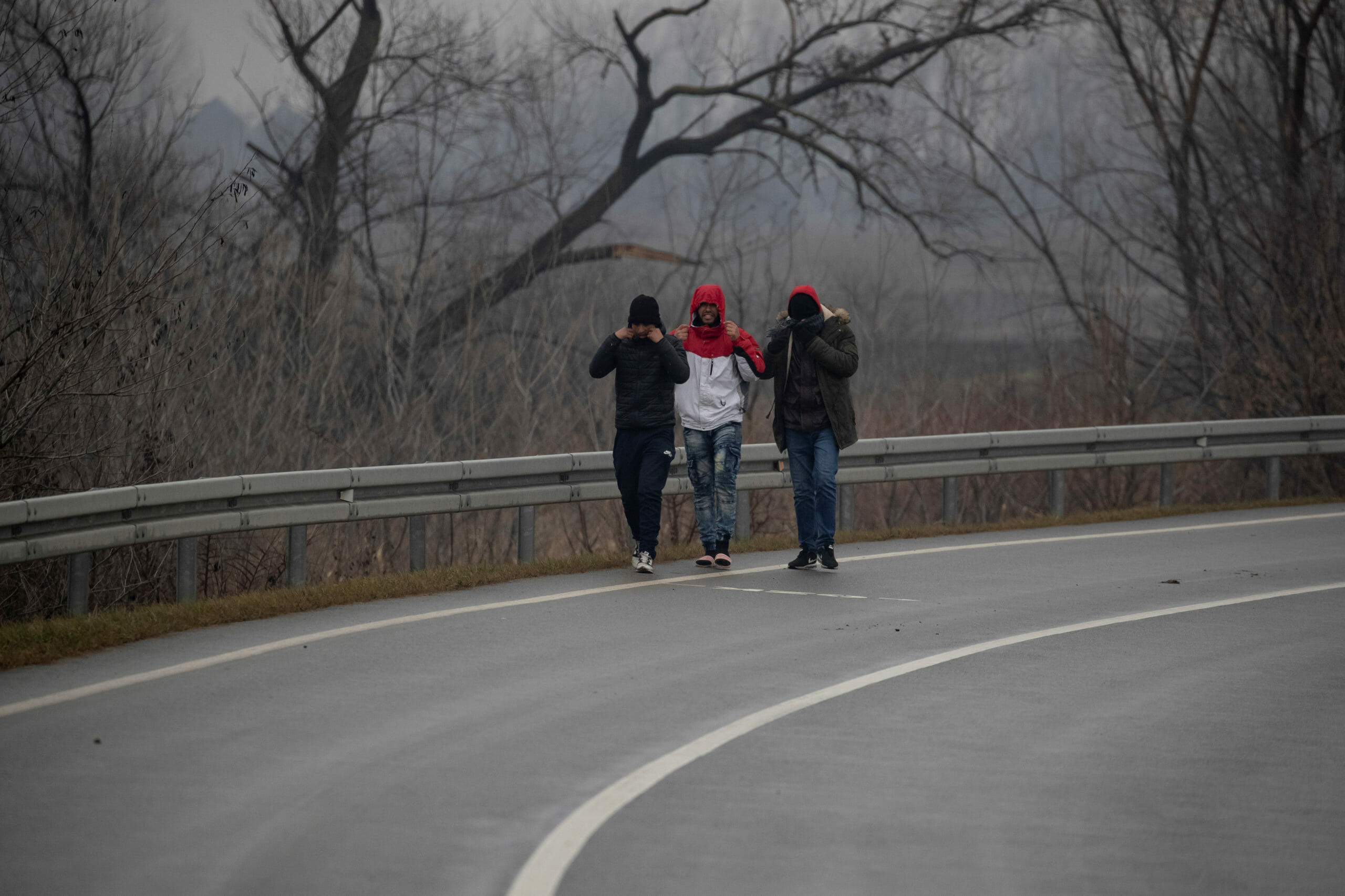 Migrants walk along a road near the Hungary-Serbia border in Horgos, Serbia, January 28, 2020. REUTERS