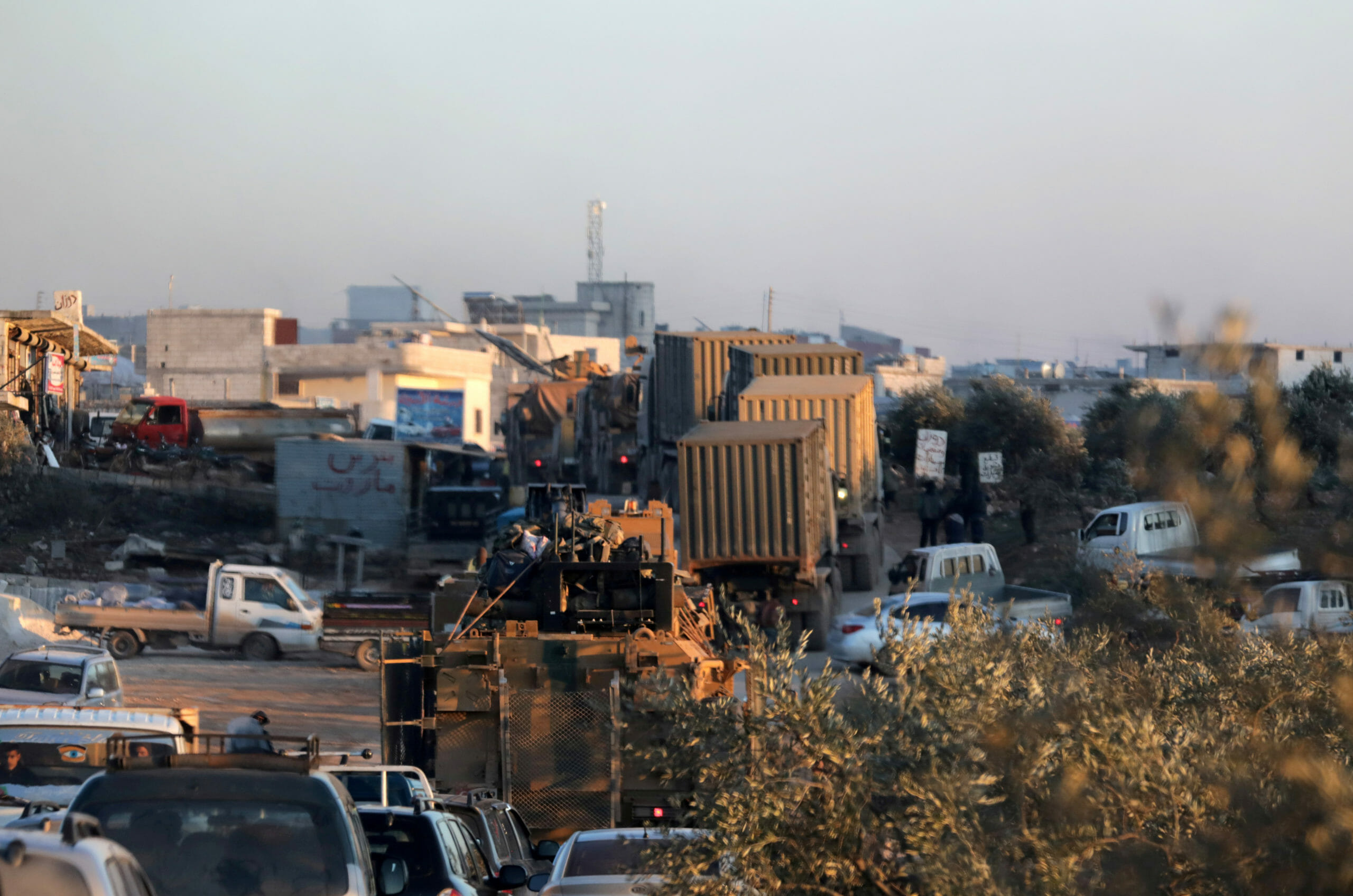 Turkish military vehicles enter the Bab al-Hawa crossing at the Syrian-Turkish border, in Idlib governorate, Syria, February 9, 2020. REUTERS