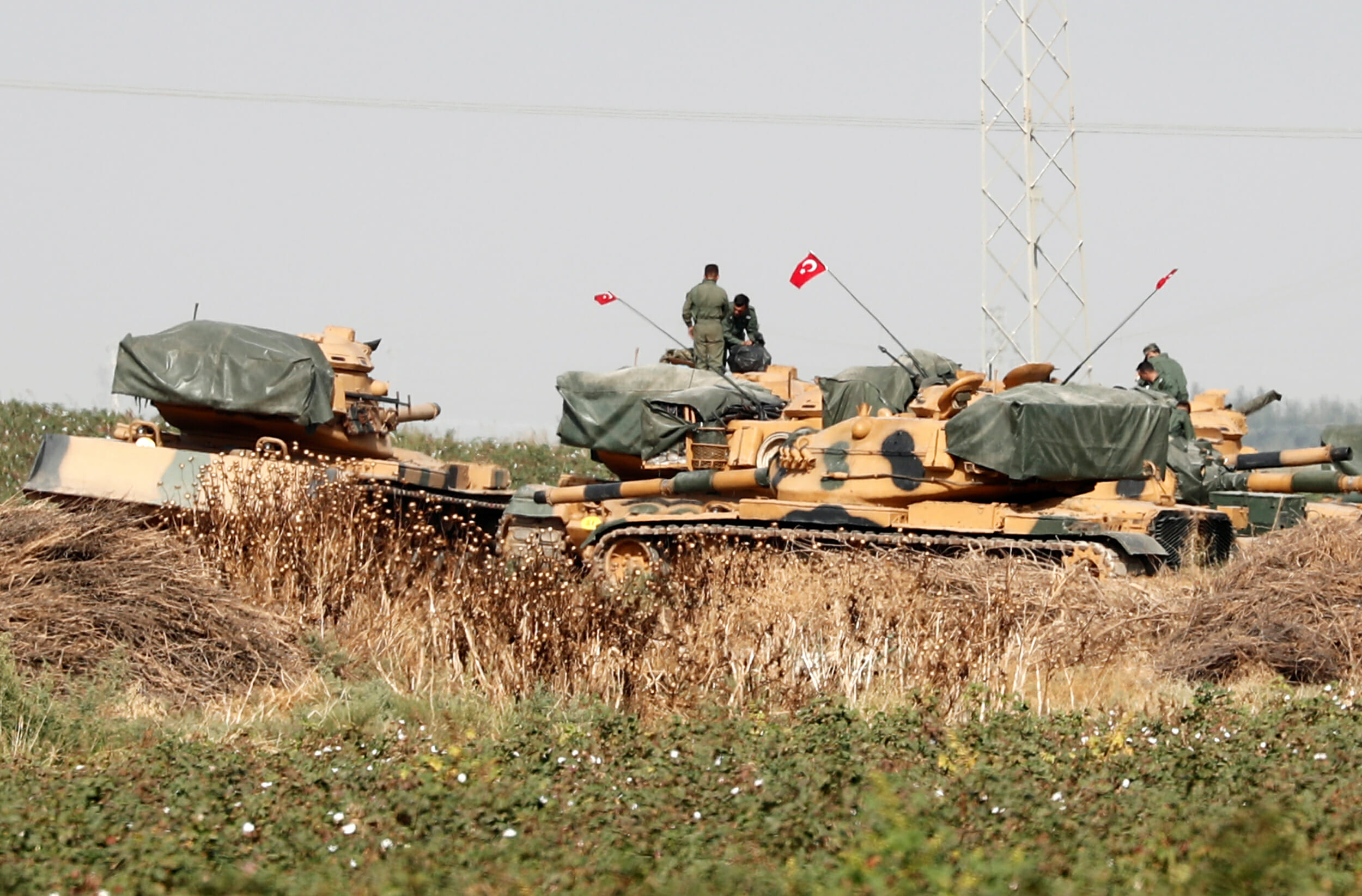 Turkish soldiers stand on top of tanks near the Turkish-Syrian border in Sanliurfa province, Turkey, October 15, 2019. REUTERS