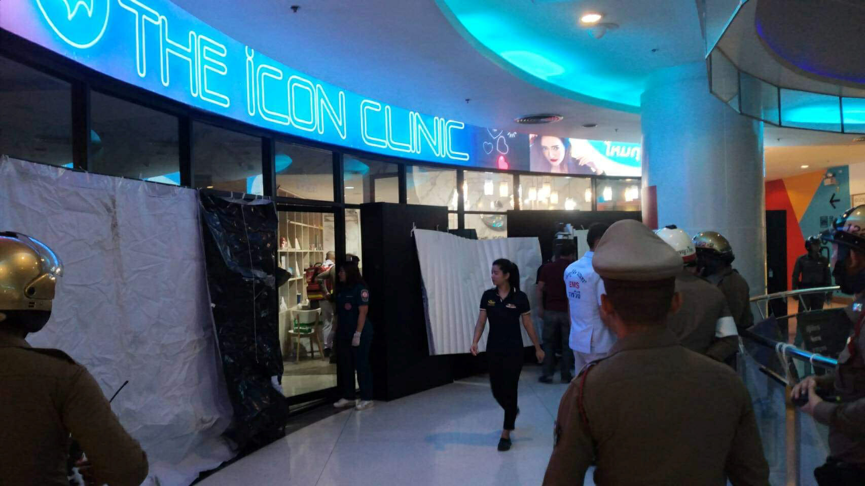 Emergency services are seen in front of a cosmetic clinic after a shooting at a shopping mall in Bangkok, Thailand February 18, 2020.  RD.CBHK079