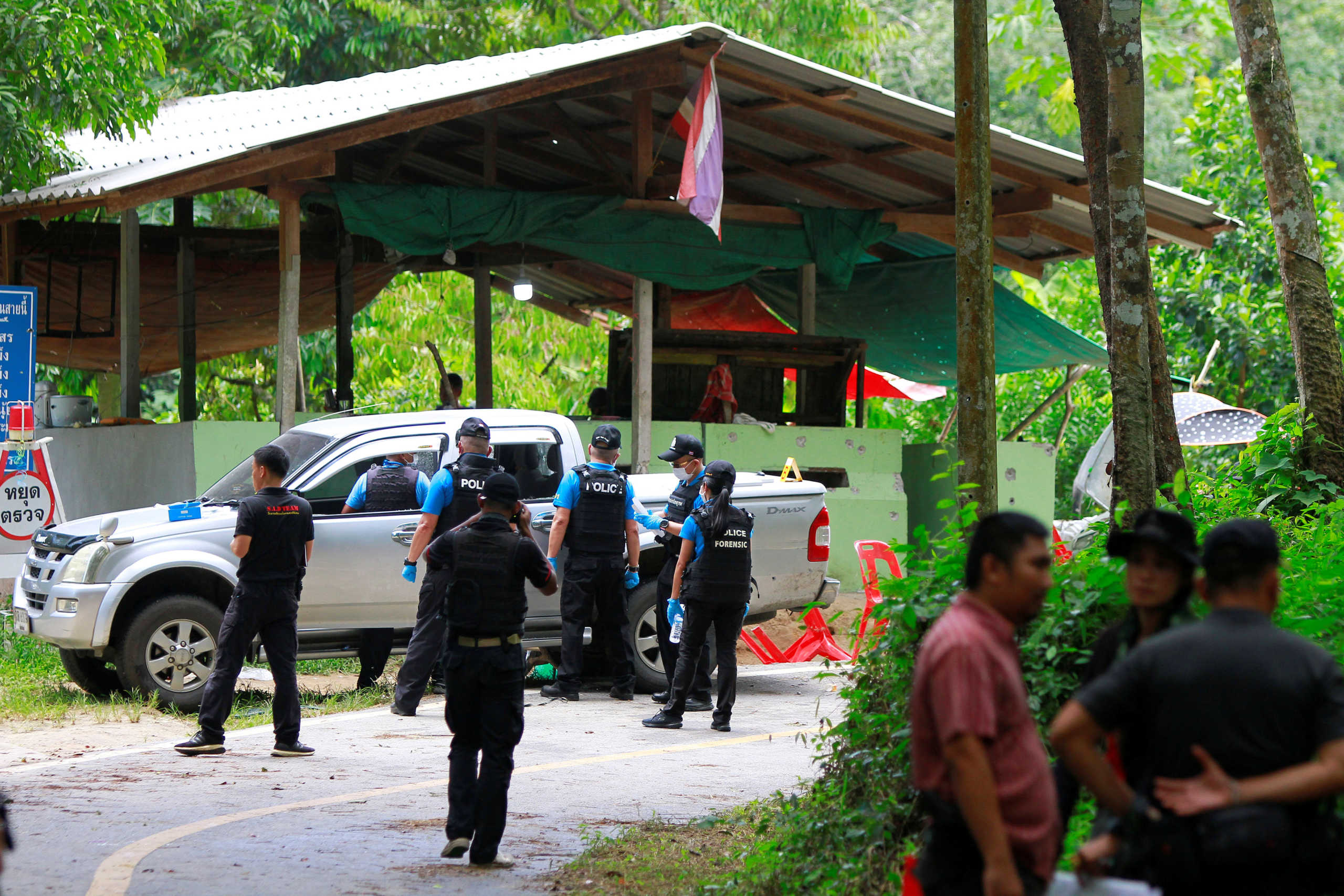 Thai forensic experts examine the site where village defence volunteers were killed by suspected separatist insurgents in Yala province, south Thailand, November 6, 2019. REUTERS