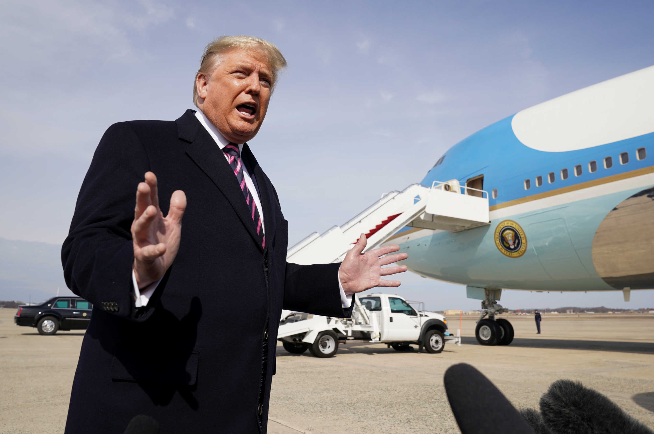U.S. President Donald Trump talks to reporters prior to boarding Air Force One as he departs Washington for campaign travel to California from Joint Base Andrews in Maryland, U.S., February 18, 2020. REUTERS