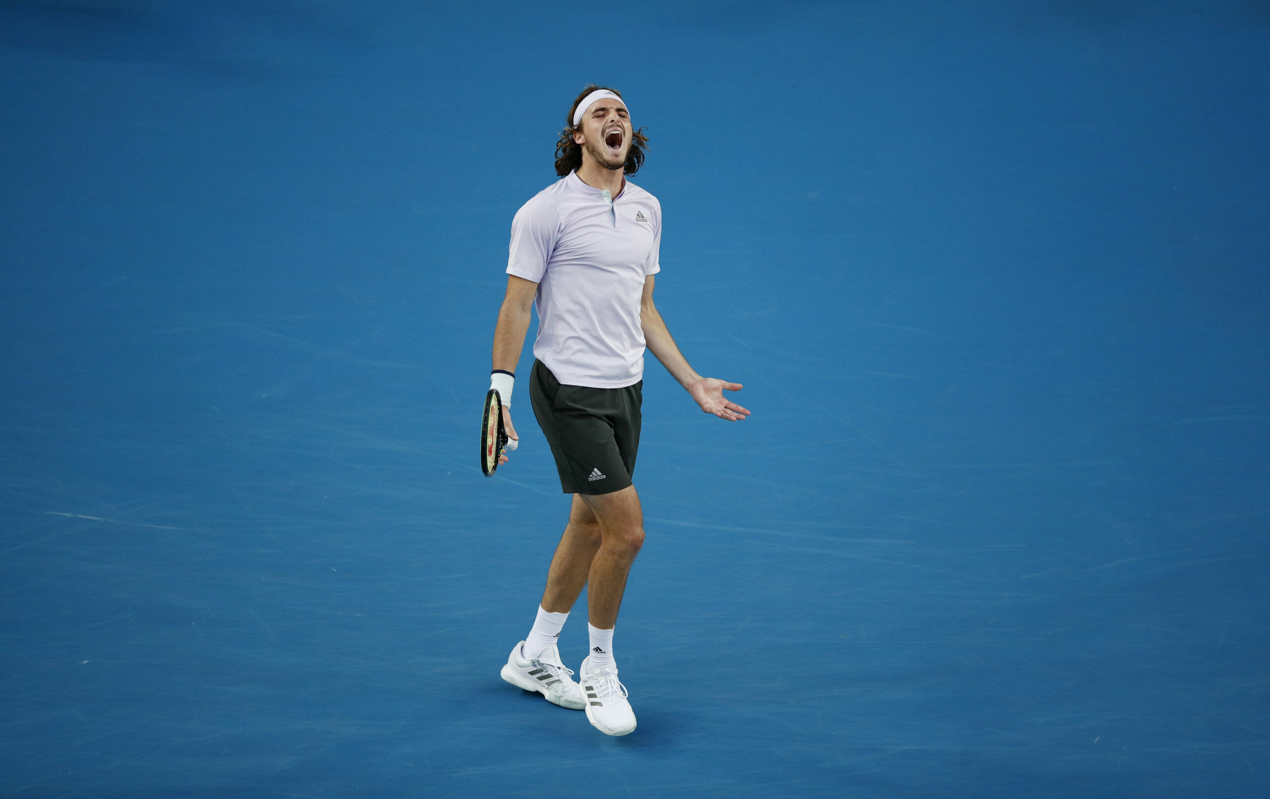 Tennis - Australian Open - Third Round - Melbourne Park, Melbourne, Australia - January 24, 2020. Greece's Stefanos Tsitsipas reacts during the match against Canada's Milos Raonic. REUTERS