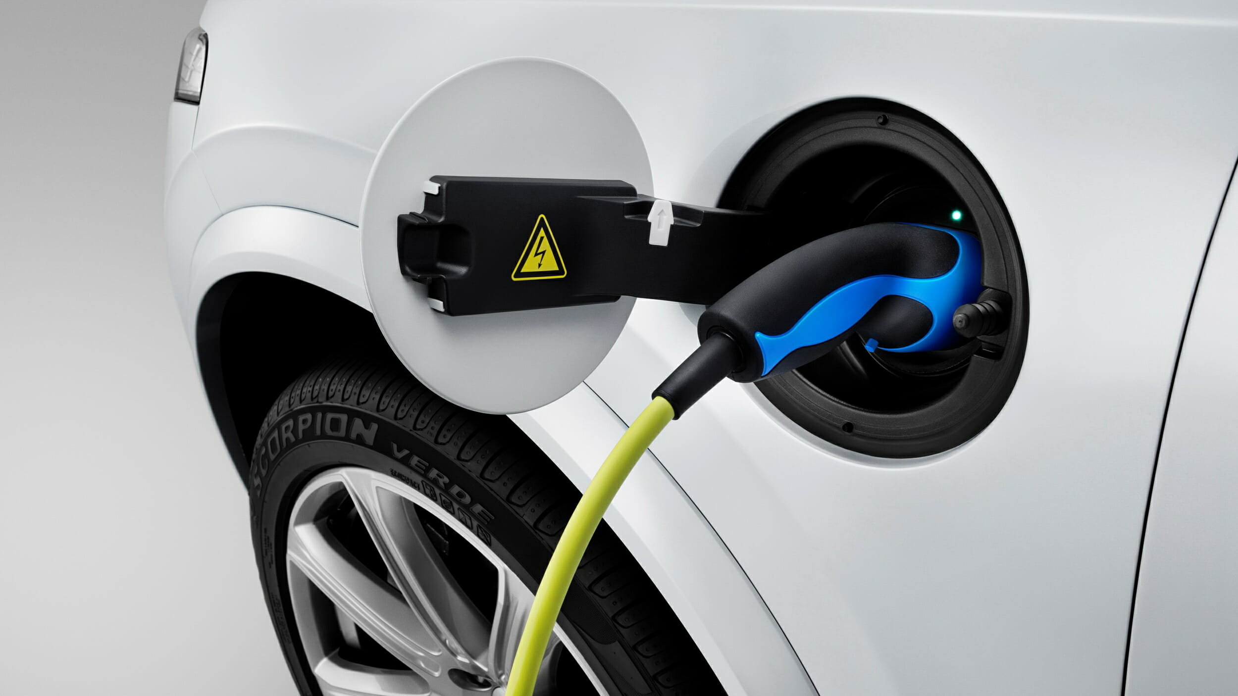 The connector for the all-new Volvo XC90 Twin Engine charge cable is located above the left front wheel arch.