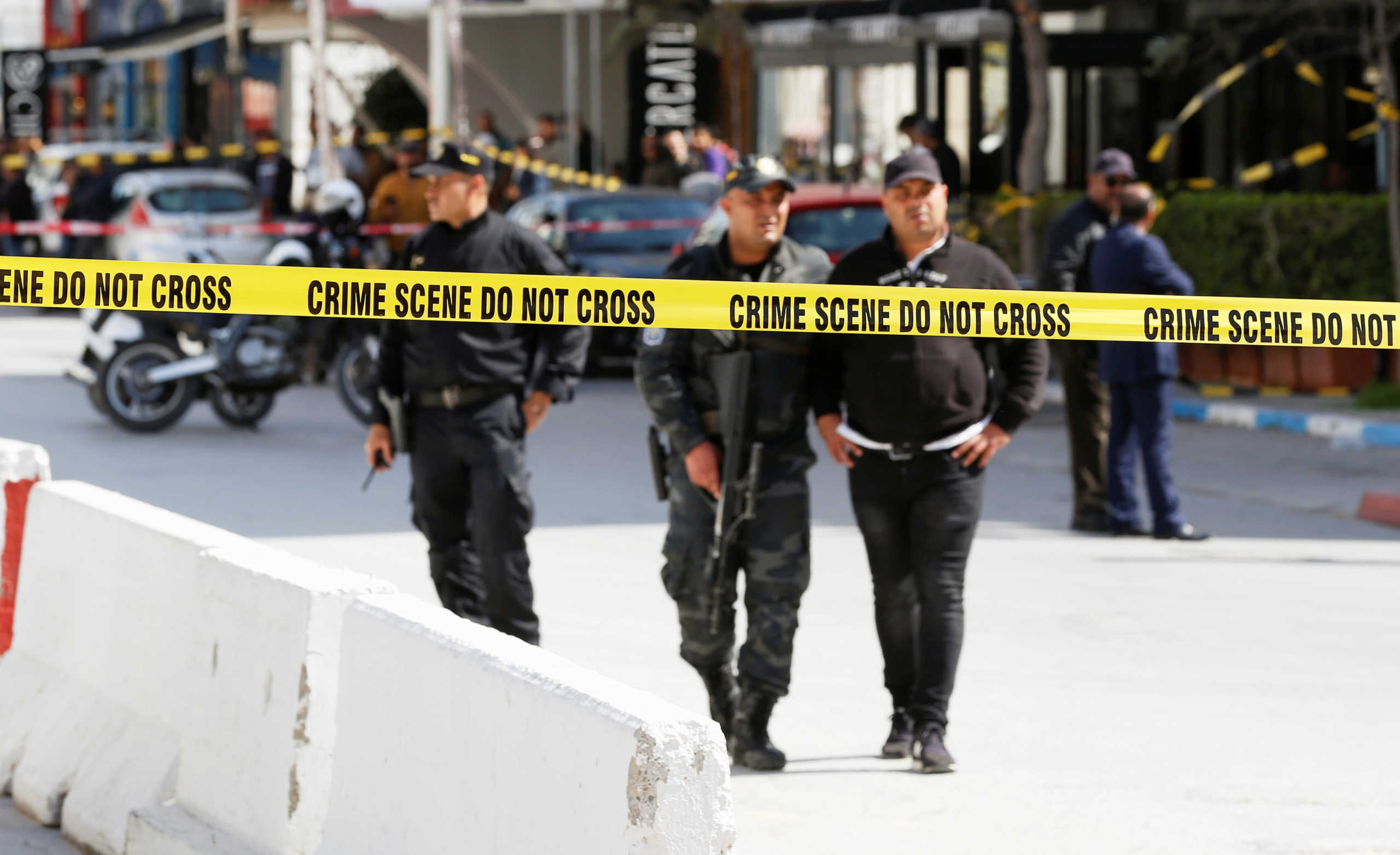 Police officers stand guard at the site of a suicide attack near the U.S. embassy in Tunis, Tunisia March 6, 2020. REUTERS