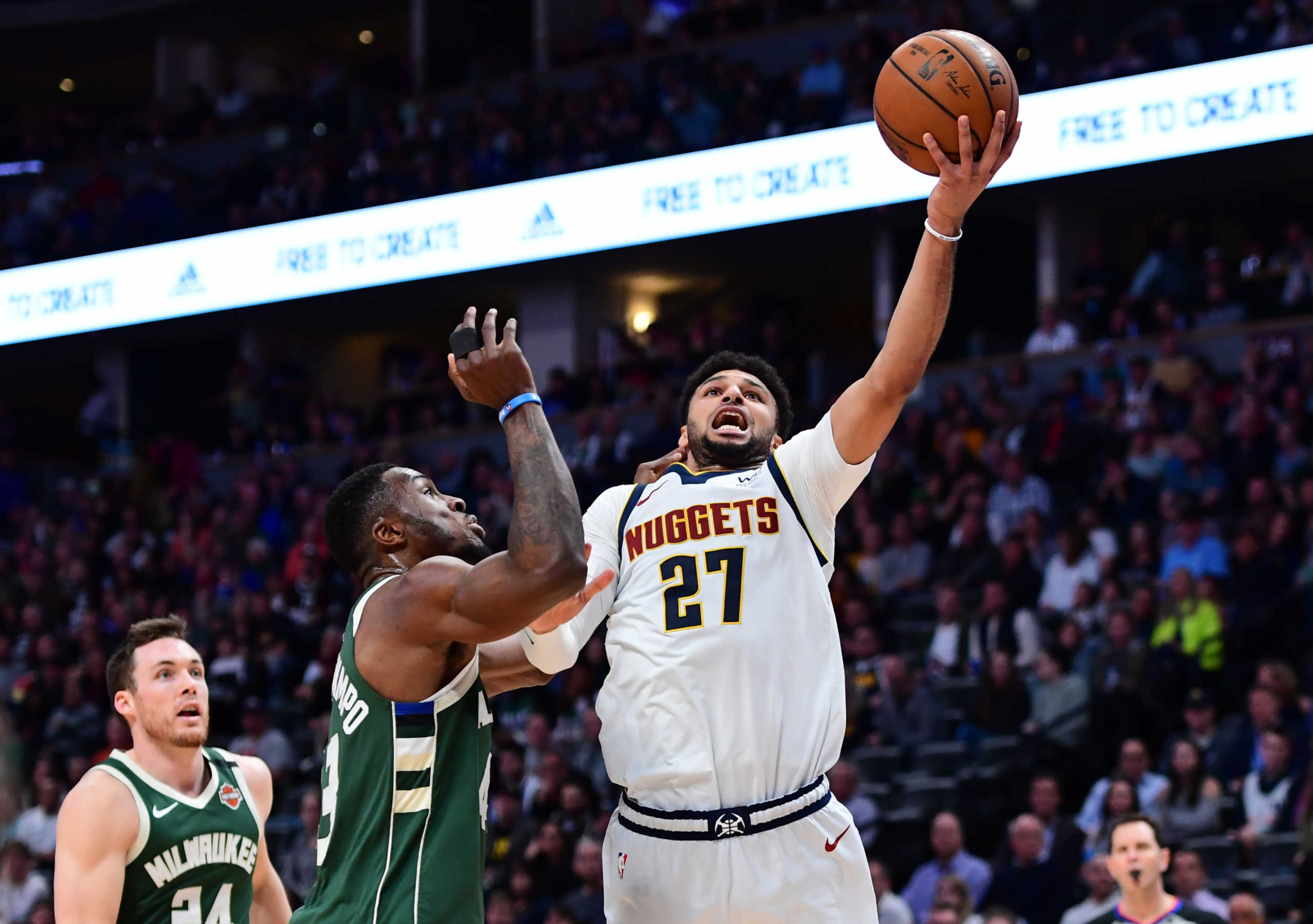 Mar 9, 2020; Denver, Colorado, USA; Denver Nuggets guard Jamal Murray (27) shoots the ball over Milwaukee Bucks forward Thanasis Antetokounmpo (43) in the second half at the Pepsi Center. Mandatory Credit: Ron Chenoy-USA TODAY Sports