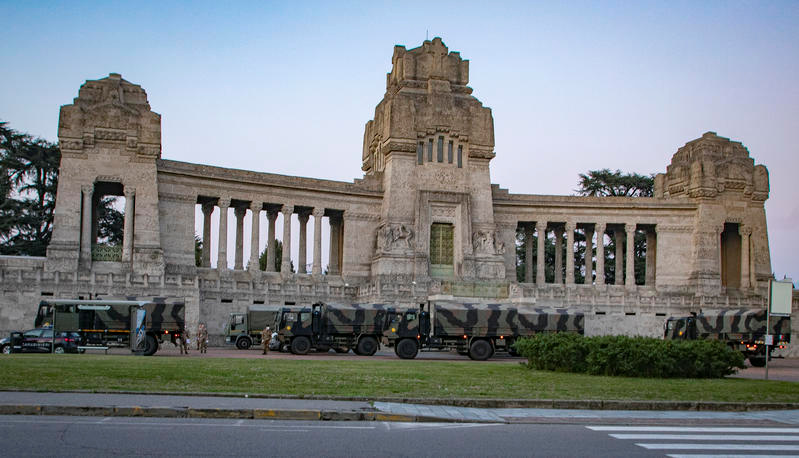 Italian military trucks and soldiers are seen by Bergamo's cemetery after the army were deployed to move coffins from the cemetery to neighbouring provinces, after the cemetery was overwhelmed by the scale of the coronavirus disease (COVID-19) outbreak, in Bergamo, Italy, March 18, 2020. Picture taken March 18, 2020. Sergio Agazzi.Fotogramma via REUTERS ATTENTION EDITORS - ITALY OUT. NO COMMERCIAL OR EDITORIAL SALES IN ITALY AND .IT WEBSITES. THIS IMAGE HAS BEEN SUPPLIED BY A THIRD PARTY. MANDATORY CREDIT.