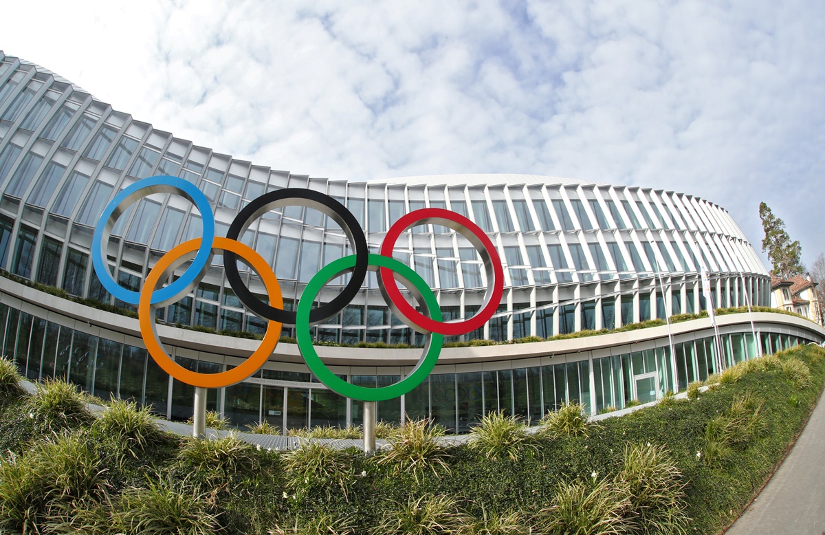The Olympic rings are pictured in front of the International Olympic Committee (IOC) in Lausanne, Switzerland, March 17, 2020. Picture taken with a fisheye lens. REUTERS