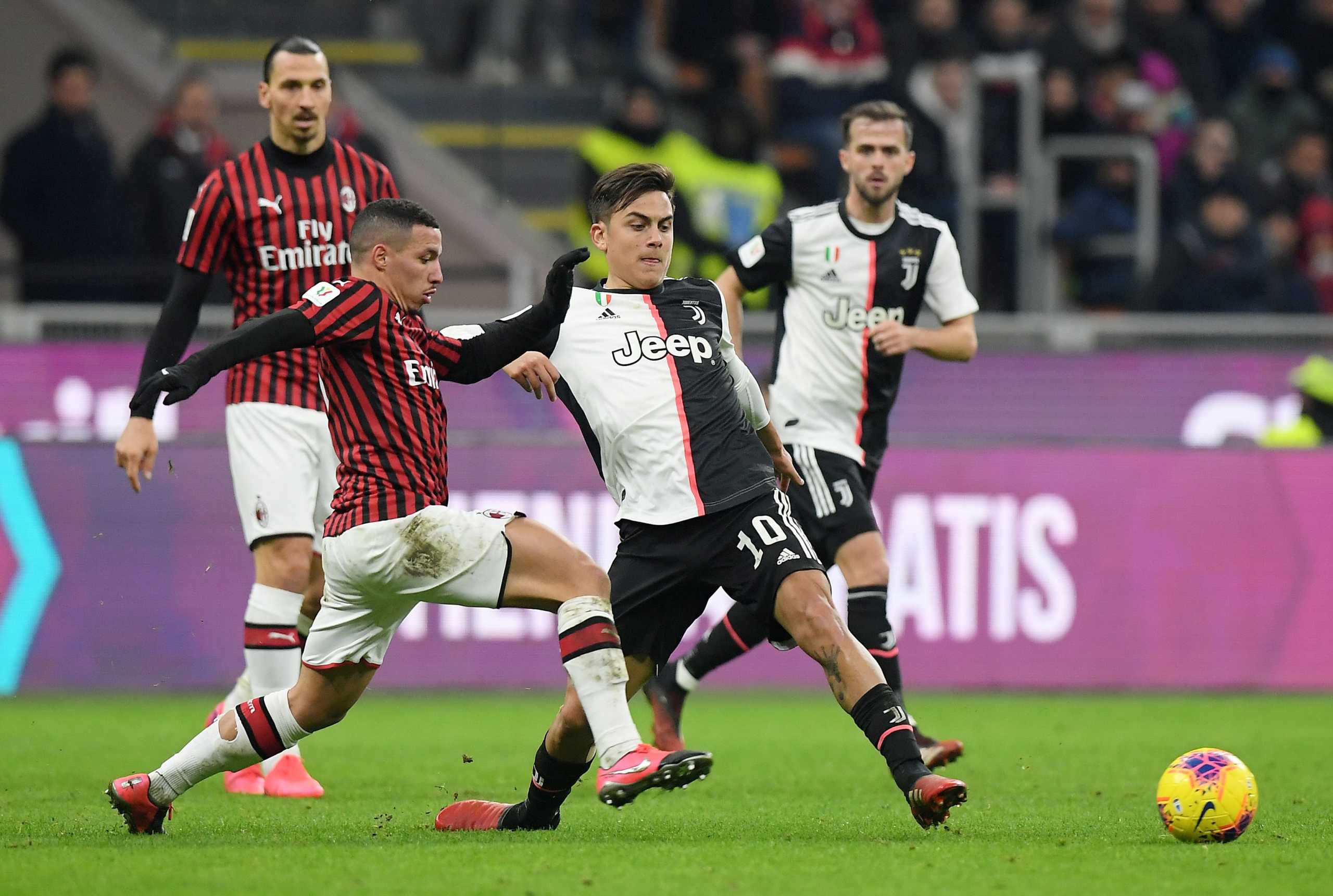 Soccer Football - Coppa Italia Semi Final First Leg - AC Milan v Juventus - San Siro, Milan, Italy - February 13, 2020   Juventus' Paulo Dybala in action with AC Milan's Ismael Bennacer              REUTERS