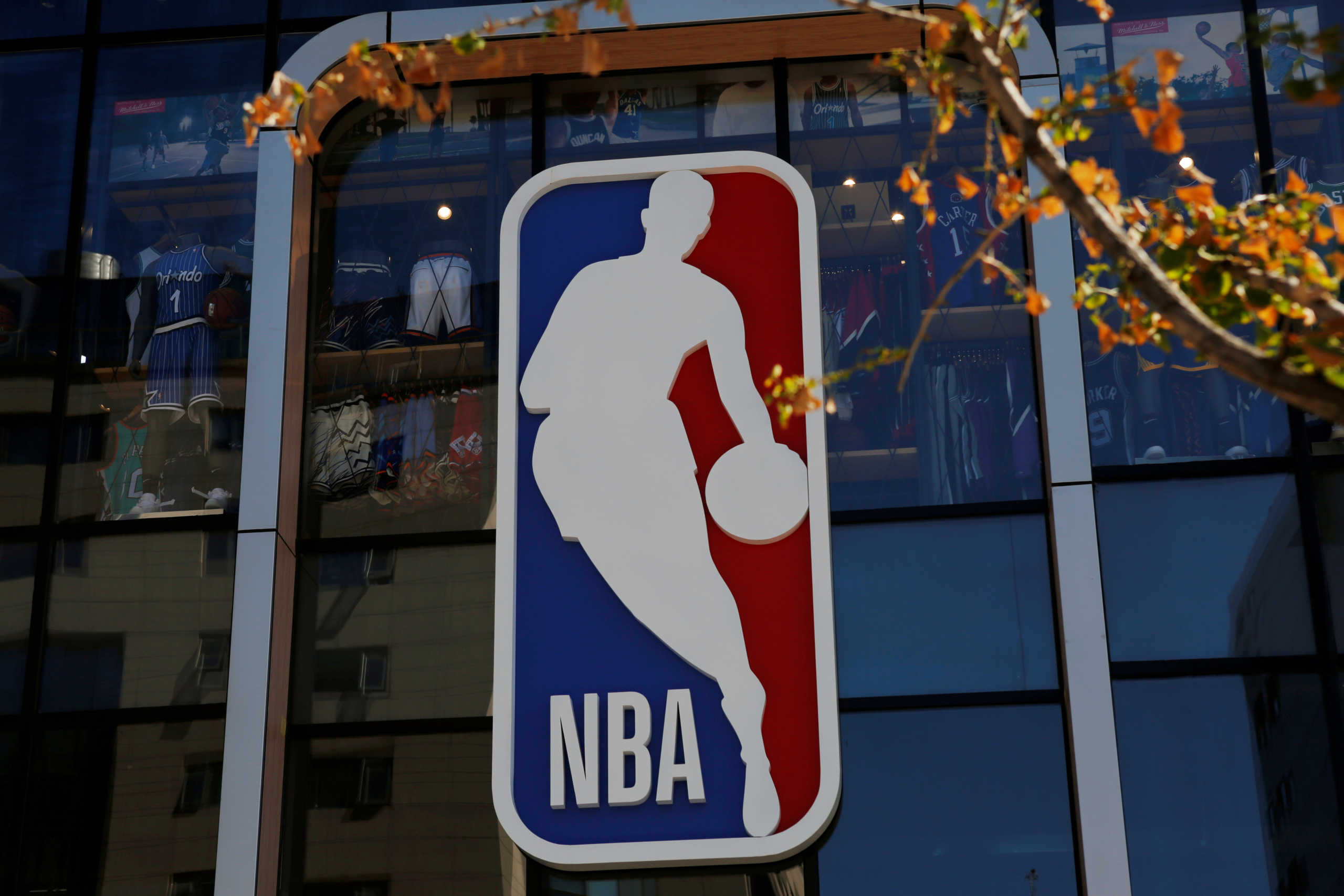 FILE PHOTO - An NBA logo is seen on the facade of its flagship store at the Wangfujing shopping street in Beijing, China October 8, 2019. REUTERS