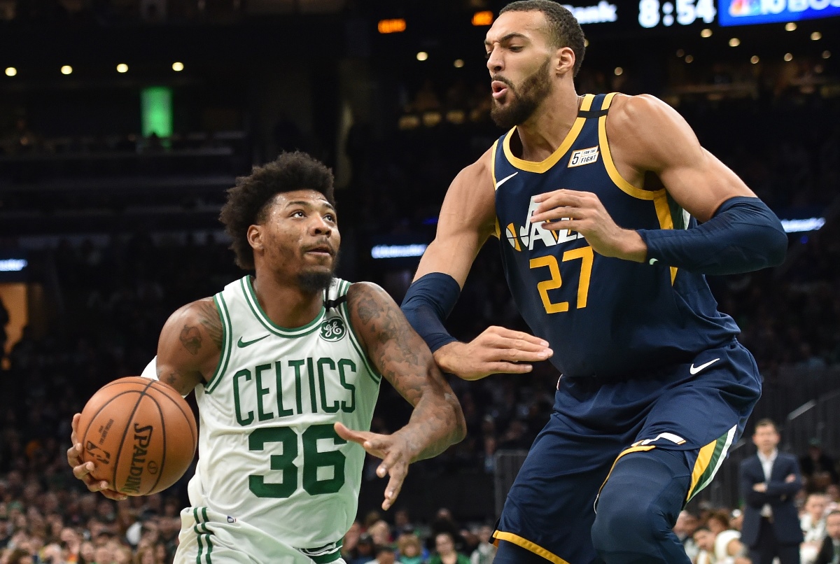 Mar 6, 2020; Boston, Massachusetts, USA;  Boston Celtics guard Marcus Smart (36) drives to the basket against Utah Jazz center Rudy Gobert (27) during the first half at TD Garden. Mandatory Credit: Bob DeChiara-USA TODAY Sports