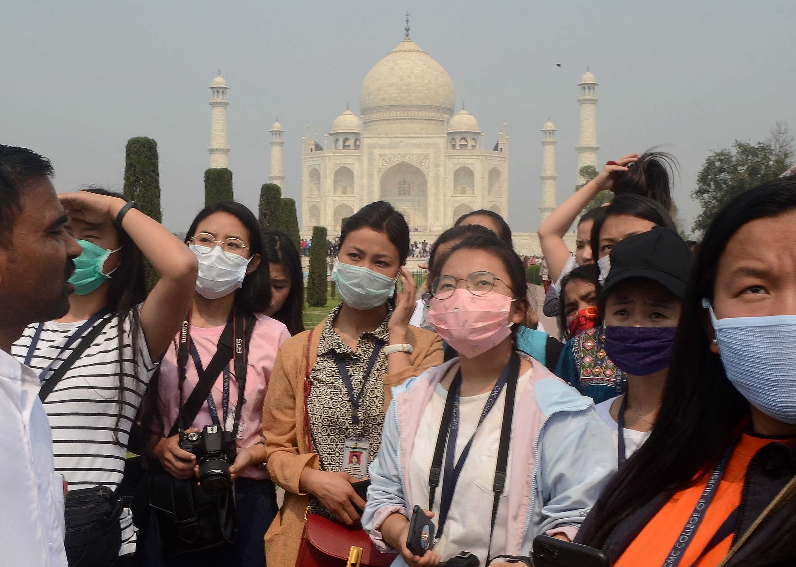 Tourists wearing protective masks are pictured at the historic Taj Mahal in Agra, India, March 3, 2020. REUTERS