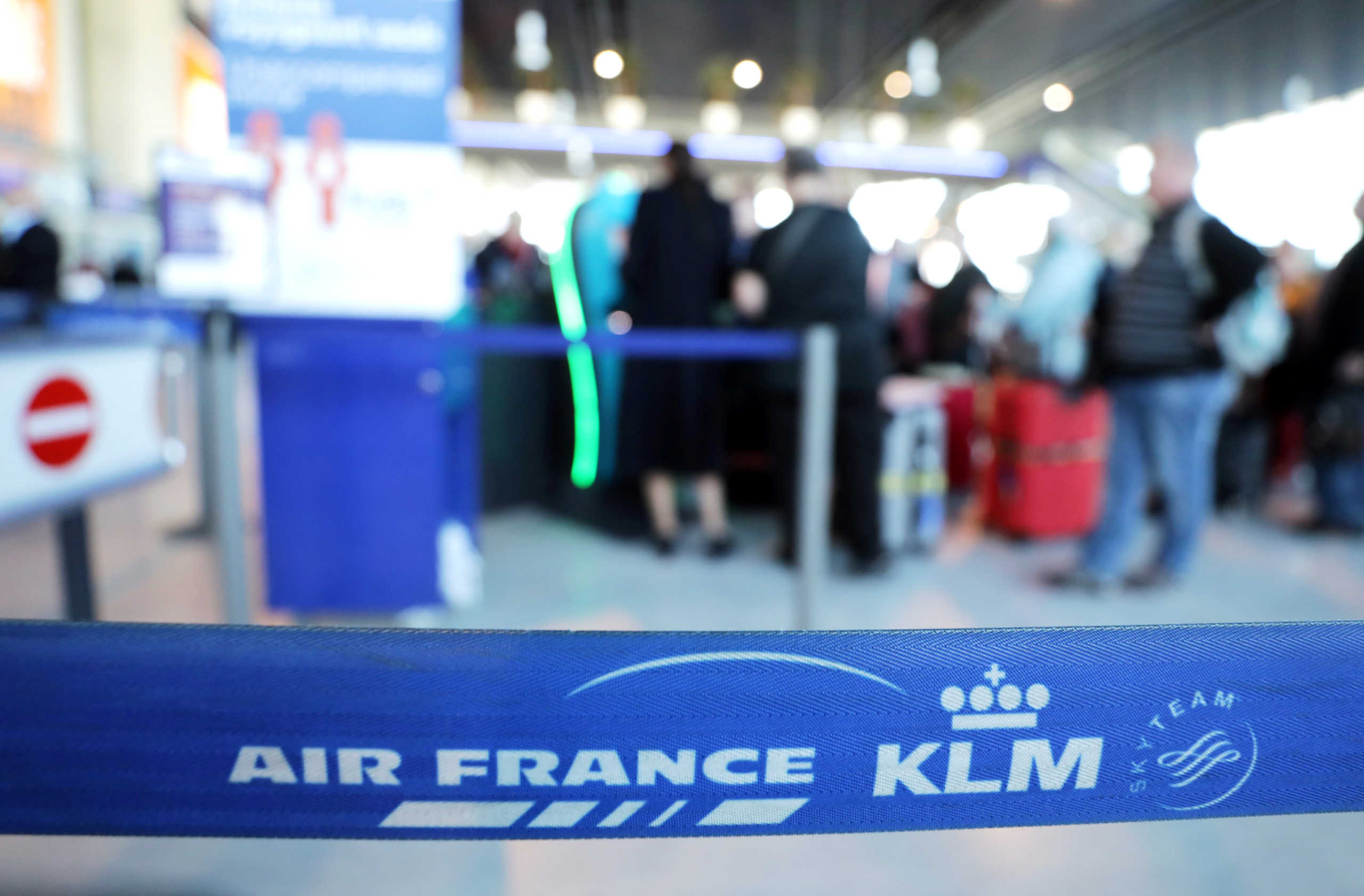 Passengers wait at the Air France desk at Nice international airport, France, February 20, 2020.     REUTERS