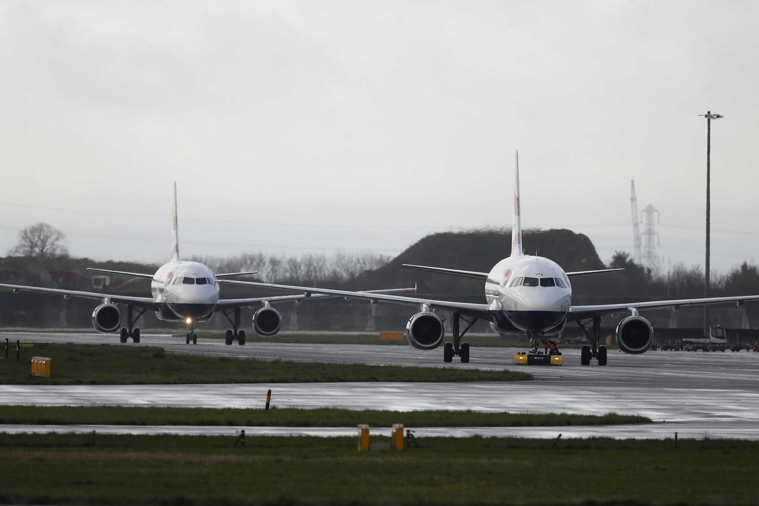 British Airways planes taxi near Terminal 5 at Heathrow Airport in London, Britain March 14, 2020. REUTERS