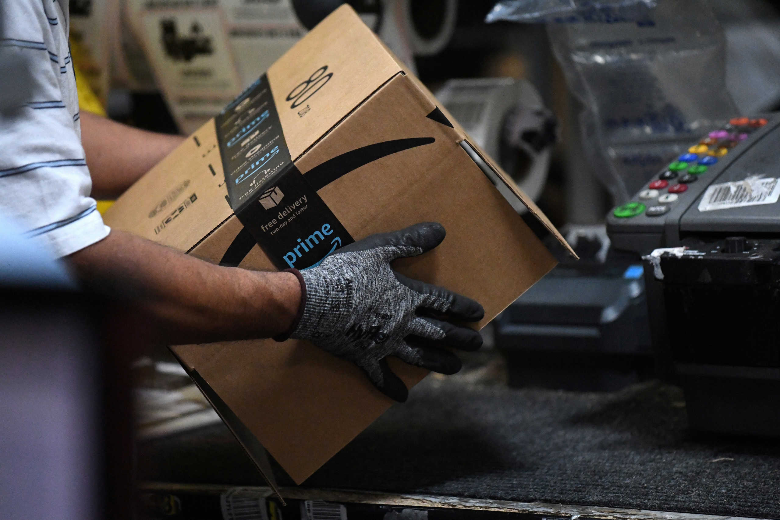 FILE PHOTO: A worker assembles a box for delivery at the Amazon fulfillment center in Baltimore, Maryland, U.S., April 30, 2019. REUTERS