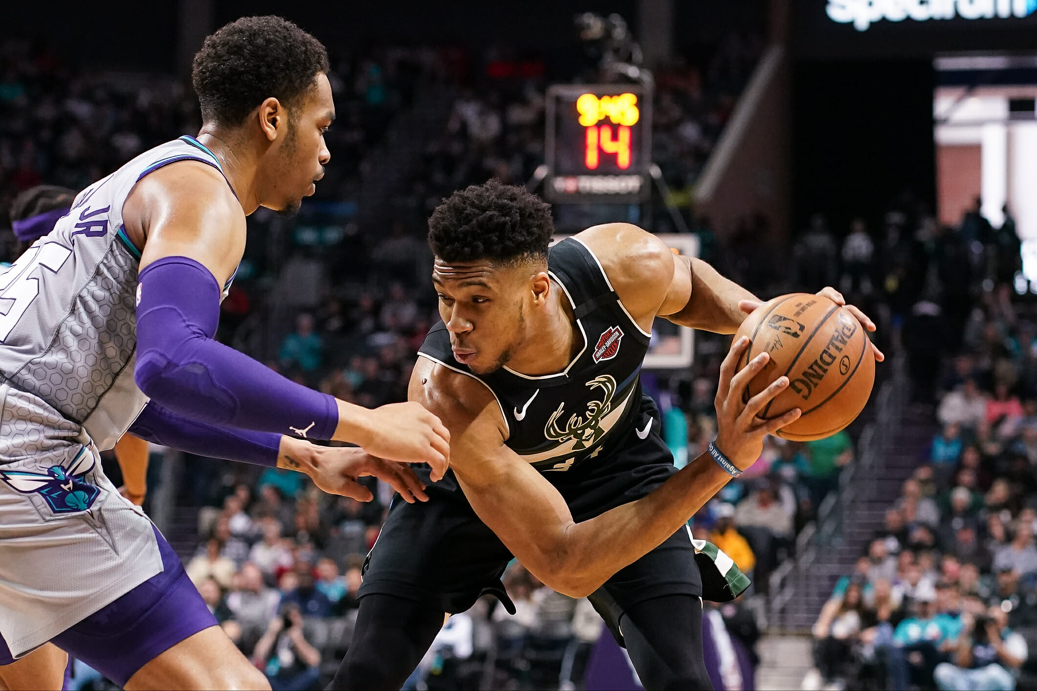 Mar 1, 2020; Charlotte, North Carolina, USA; Milwaukee Bucks forward Giannis Antetokounmpo (34) handles the ball against Charlotte Hornets forward PJ Washington (25) during the second half at Spectrum Center. Mandatory Credit: Jim Dedmon-USA TODAY Sports
