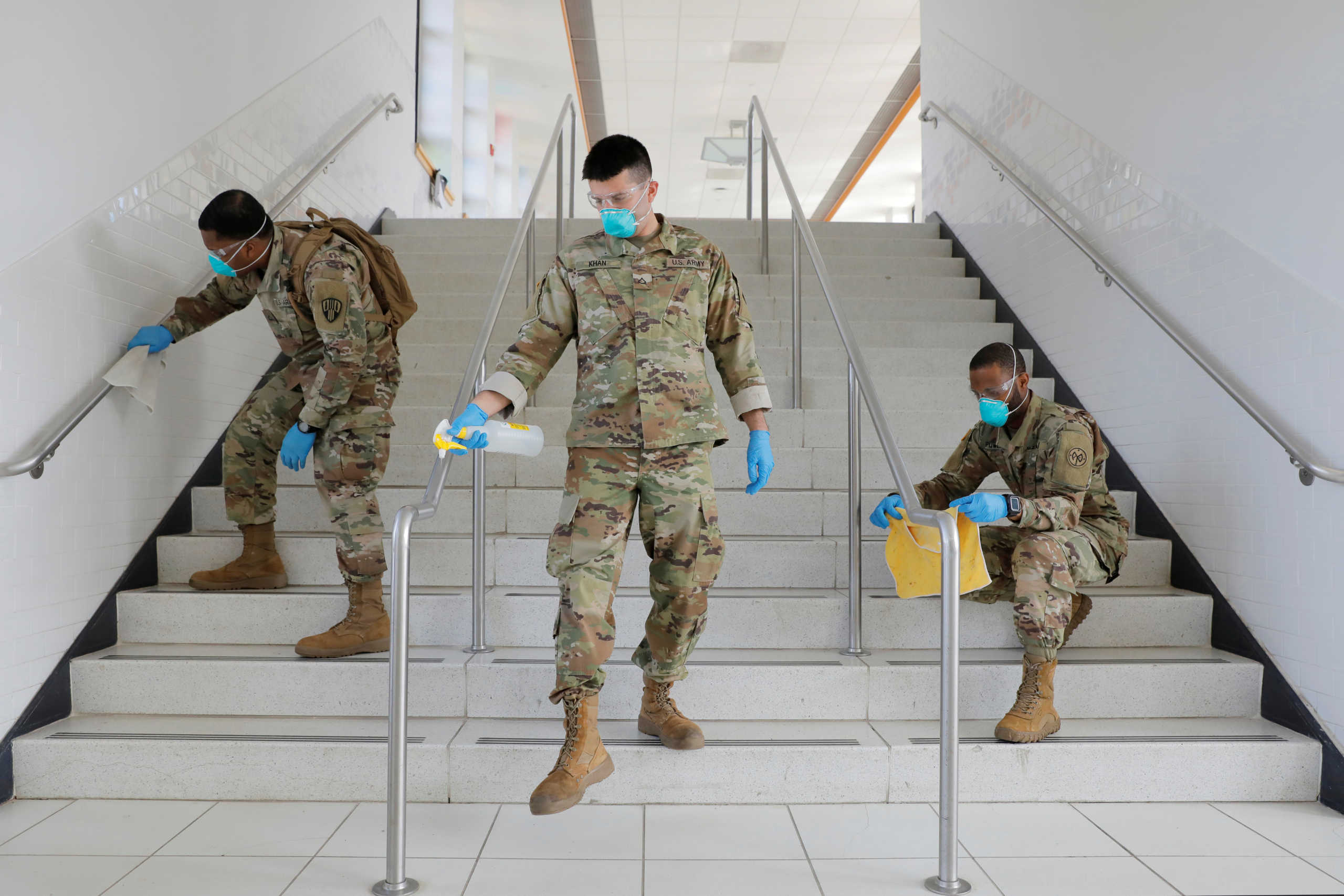 Members of Joint Task Force 2, composed of soldiers and airmen from the New York Army and Air National Guard, work to sanitize the New Rochelle High School during the coronavirus disease (COVID-19) outbreak in New Rochelle, New York, U.S., March 21, 2020. REUTERS