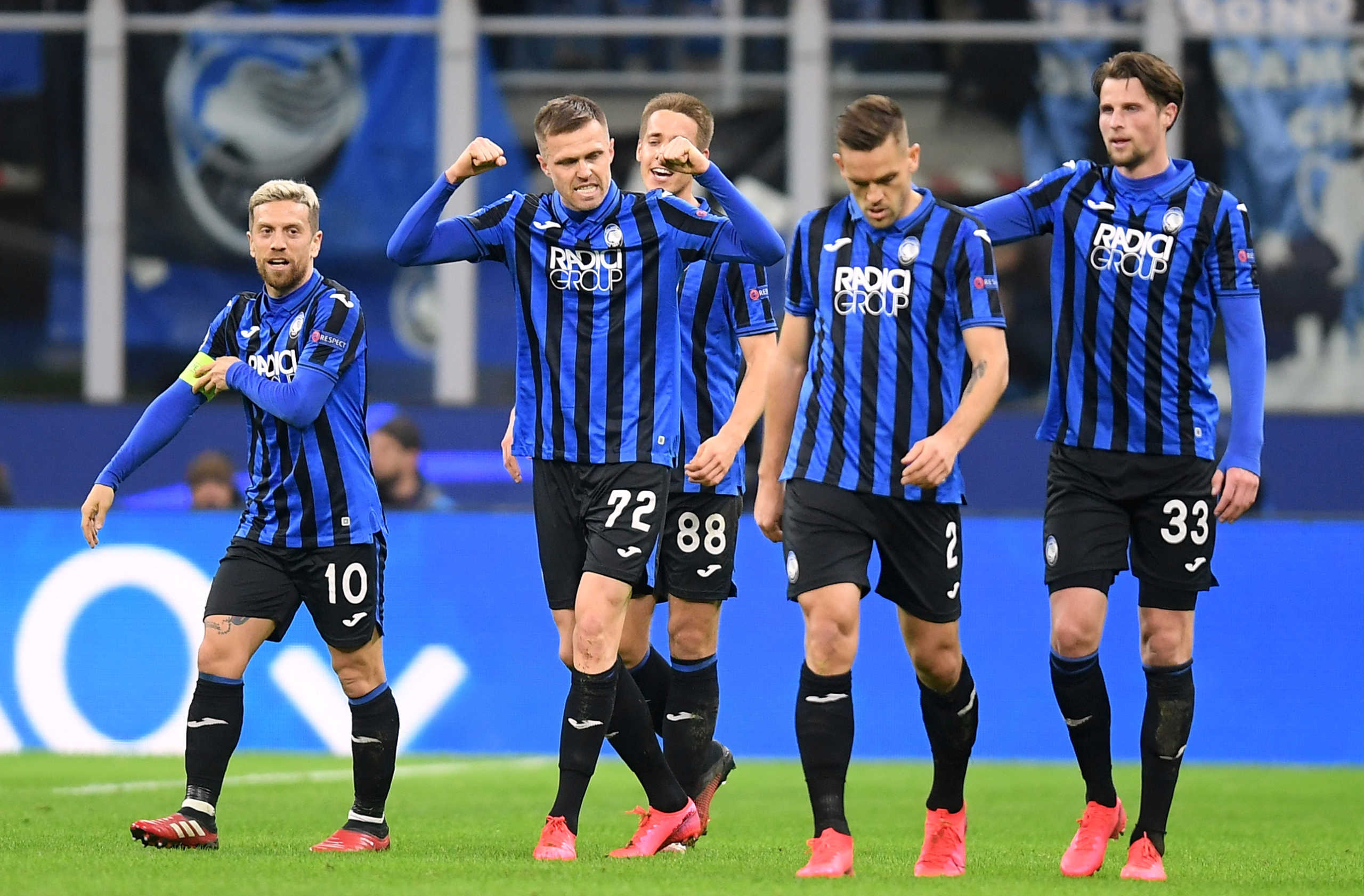 Soccer Football - Champions League - Round of 16 First Leg - Atalanta v Valencia - San Siro, Milan, Italy - February 19, 2020  Atalanta's Josip Ilicic celebrates scoring their second goal with teammates   REUTERS