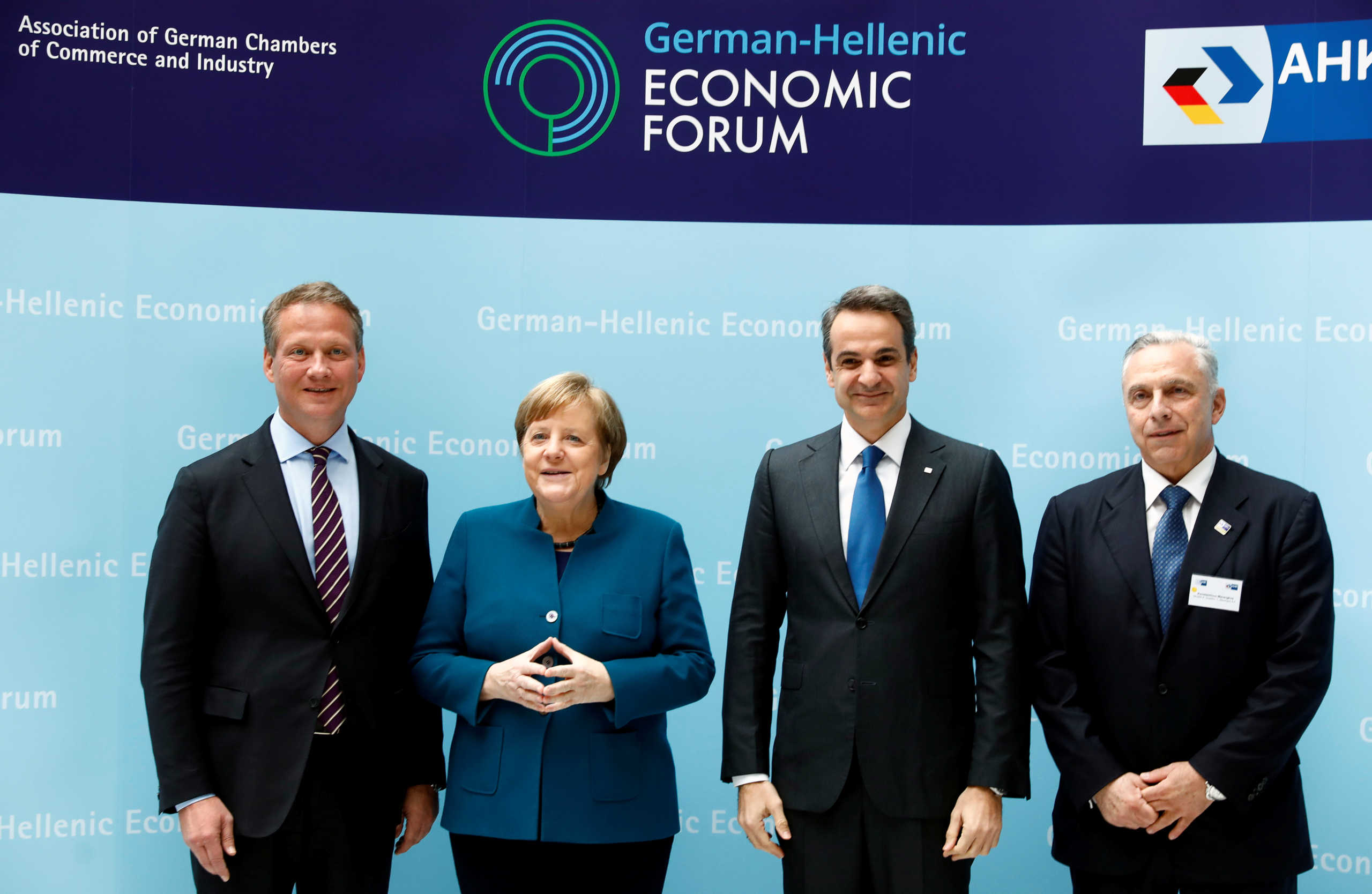German Chancellor Angela Merkel and Greek Prime Minister Kyriakos Mitsotakis pose during a German-Greek business forum in Berlin, Germany, March 9, 2020. REUTERS