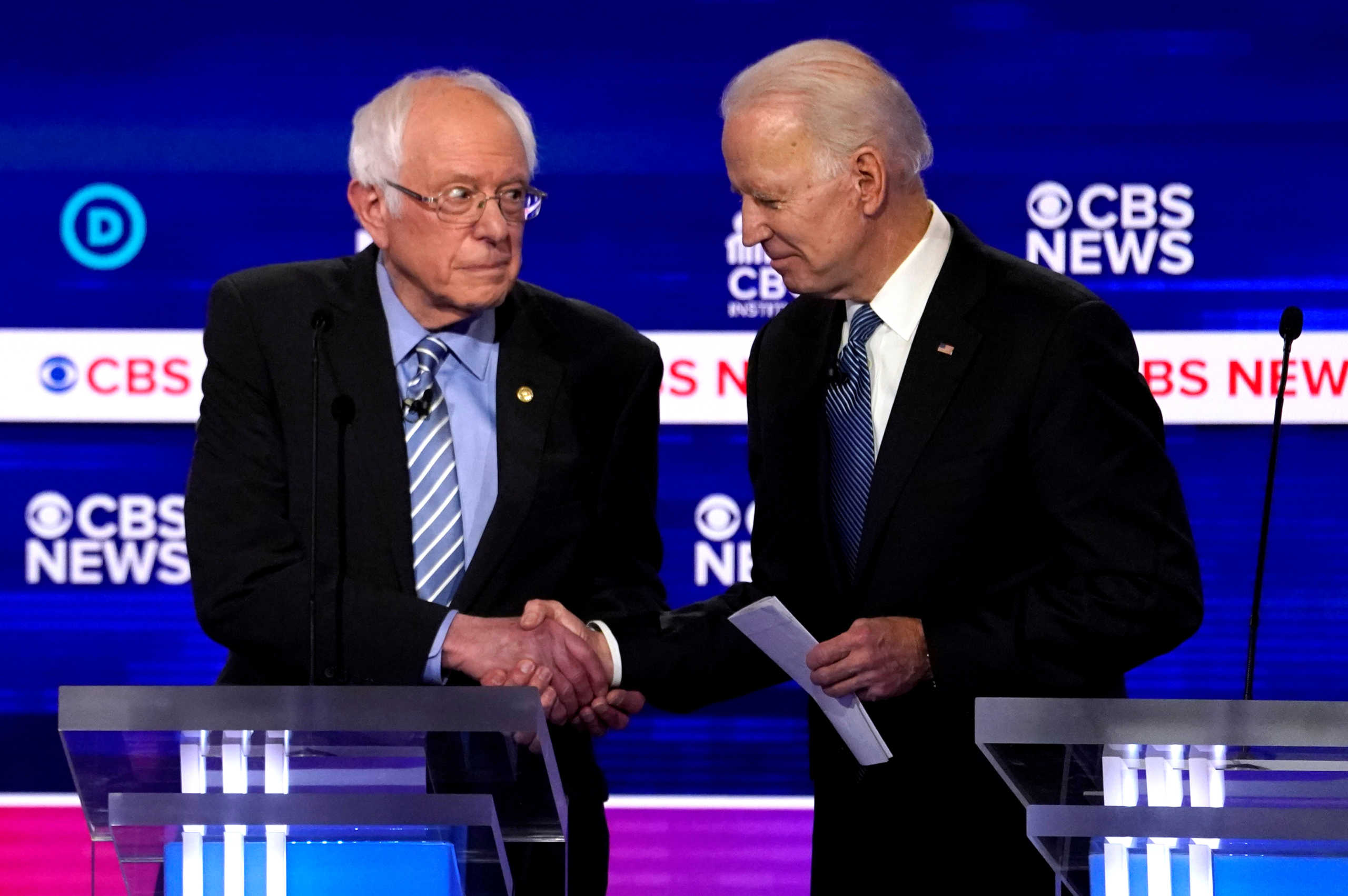 FILE PHOTO: FILE PHOTO: Democratic 2020 U.S. presidential candidates Senator Bernie Sanders shakes hands with former Vice President Joe Biden after the tenth Democratic 2020 presidential debate at the Gaillard Center in Charleston, South Carolina, U.S. February 25, 2020. REUTERS