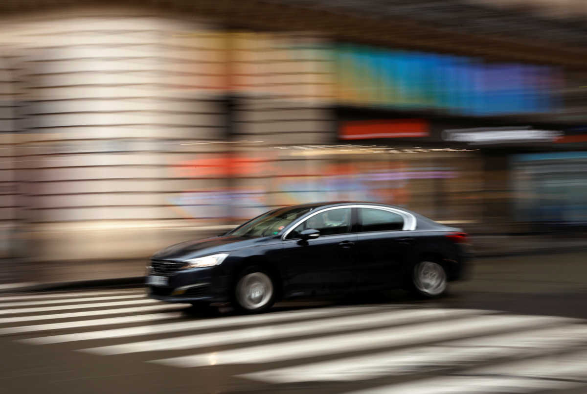 A ride-hailing driver, known in France as VTC (transport car with driver), drives in central Paris, France March 5, 2020. REUTERS
