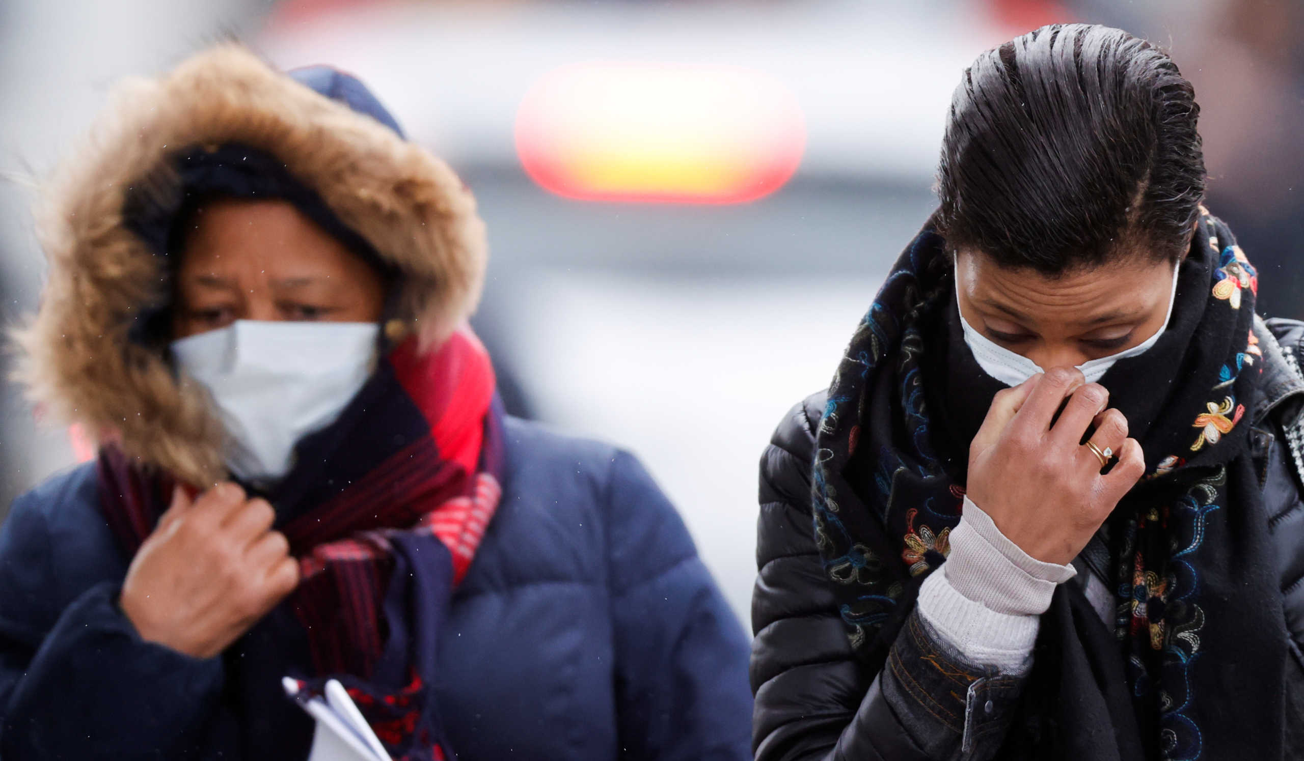 People wearing masks leave Creil's hospital, where people tested positive for coronavirus have been treated, France, February 27, 2020. REUTERS