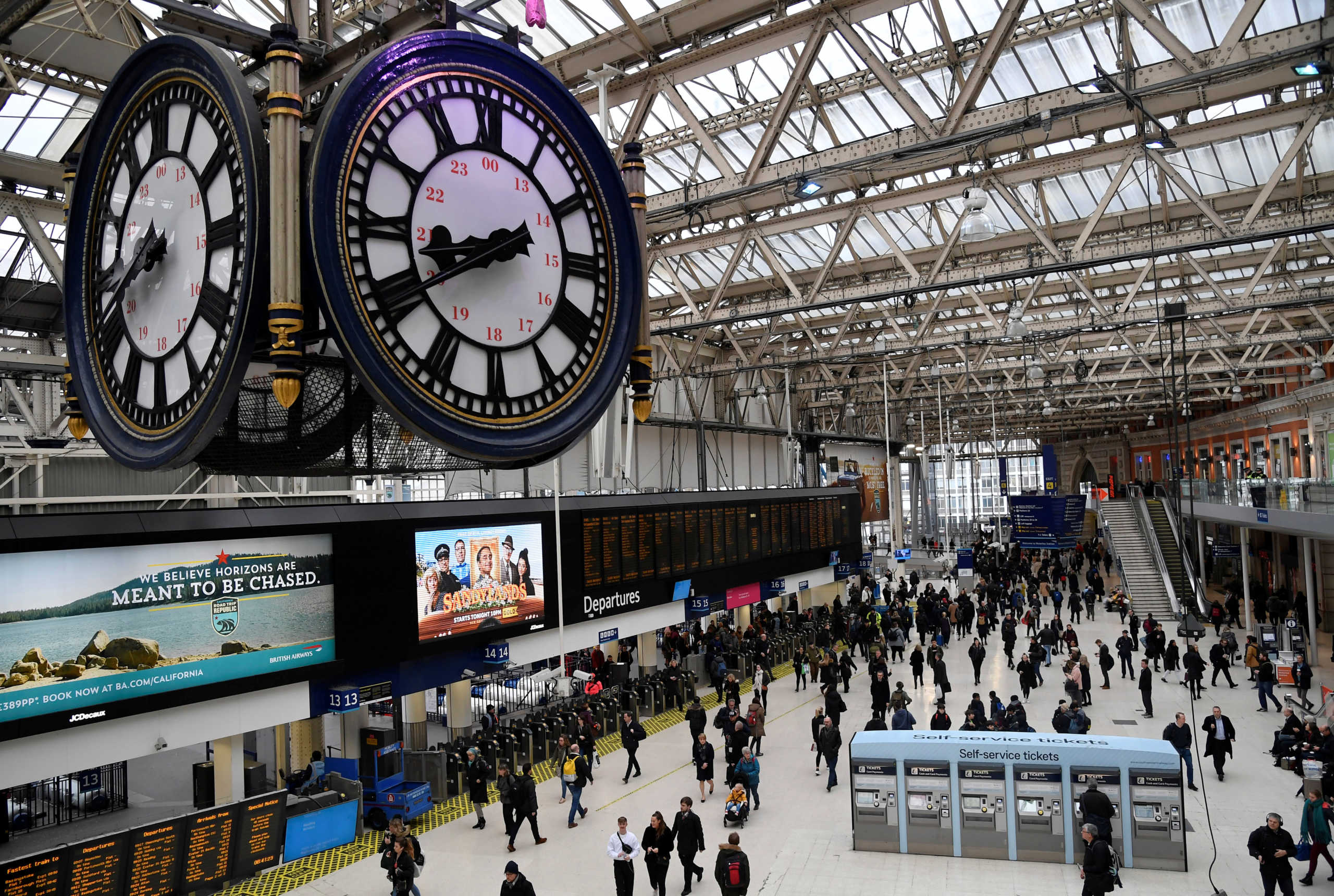 Workers are seen arriving during the morning rush hour at Waterloo Station in London, Britain, March 4, 2020. REUTERS