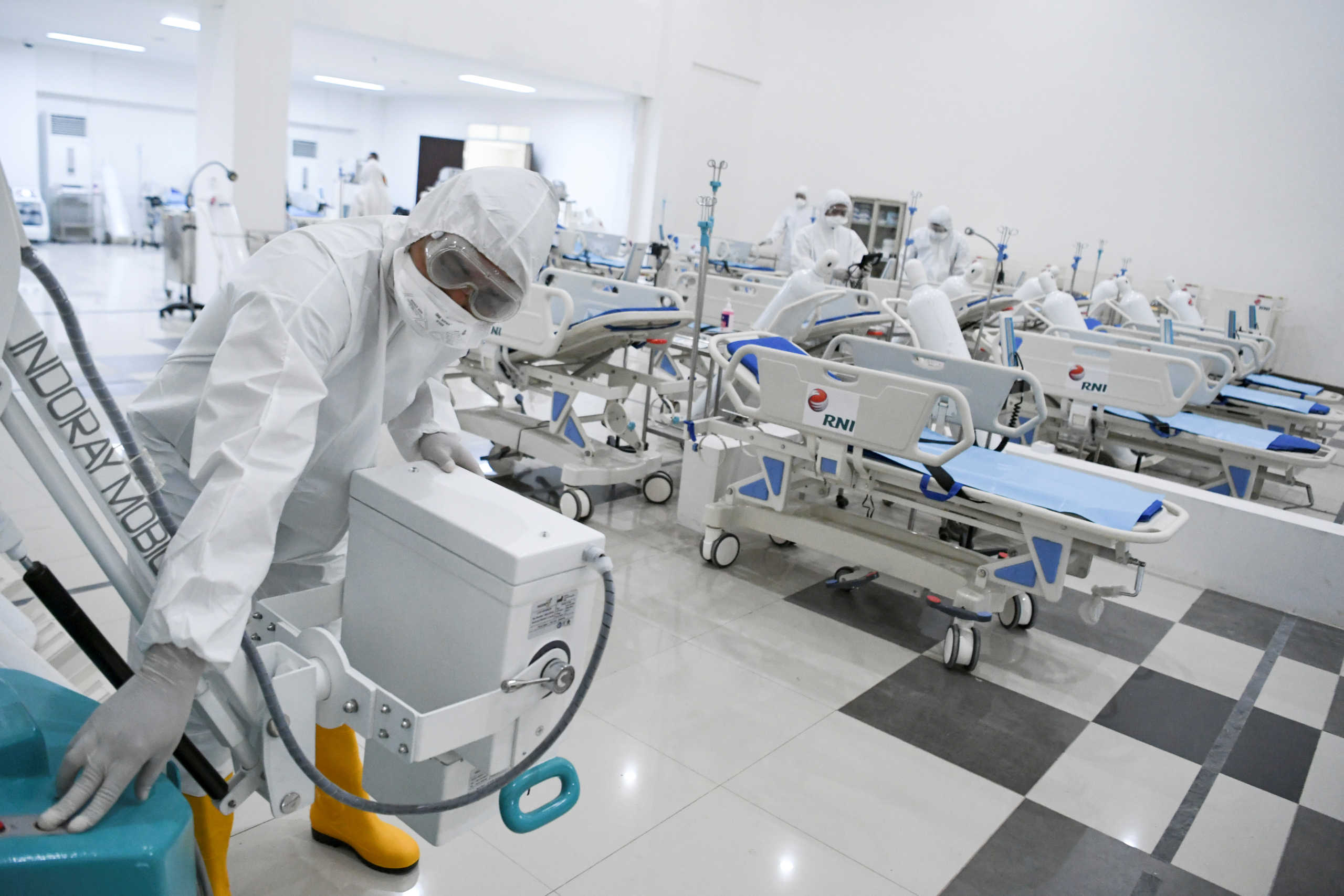 A medical officer checks devices at an emergency hospital, handling coronavirus disease (COVID-19) at Kemayoran Athletes Village, in Jakarta, Indonesia March 23, 2020. Antara Foto
