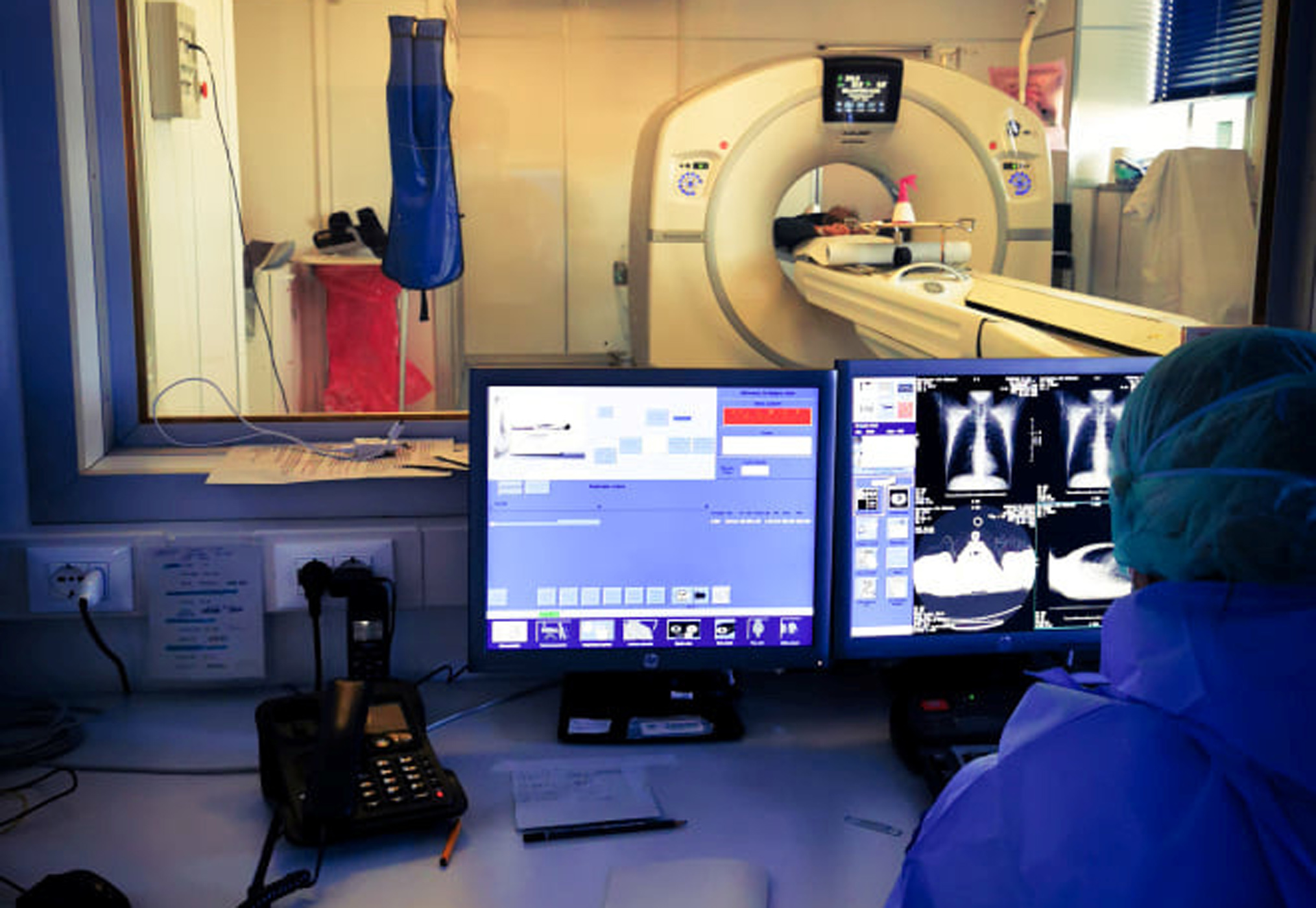 Medical staff perform a chest scan on their colleague, a doctor who turned out to have contracted coronavirus, at a hospital in Cremona, Italy March 23, 2020 in this picture obtained from social media March 28, 2020. Francesca Mangiatordi