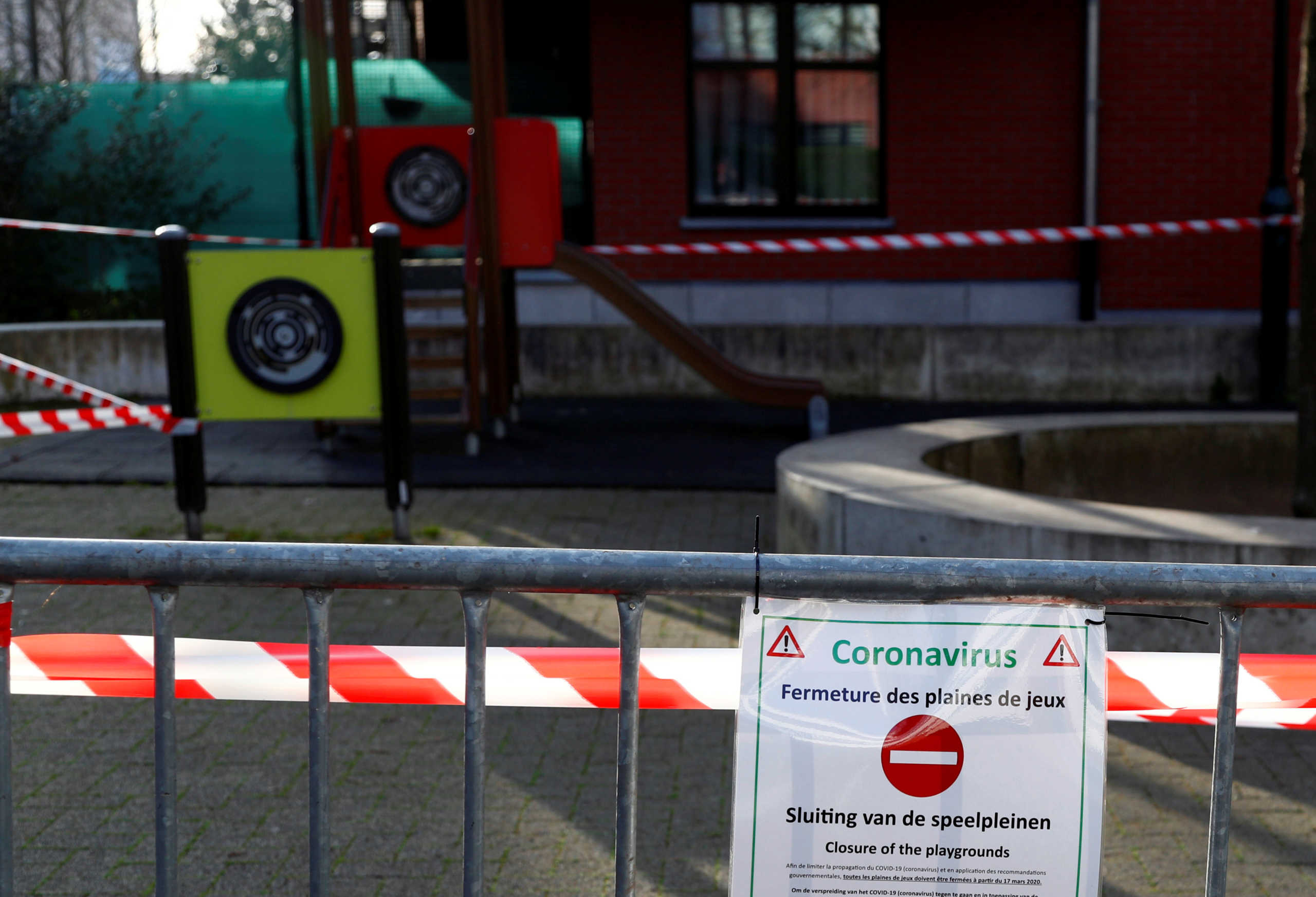 A closed playground is seen in a residential area to prevent the spread of coronavirus (COVID-19) disease, in Brussels, Belgium March 17, 2020.  REUTERS
