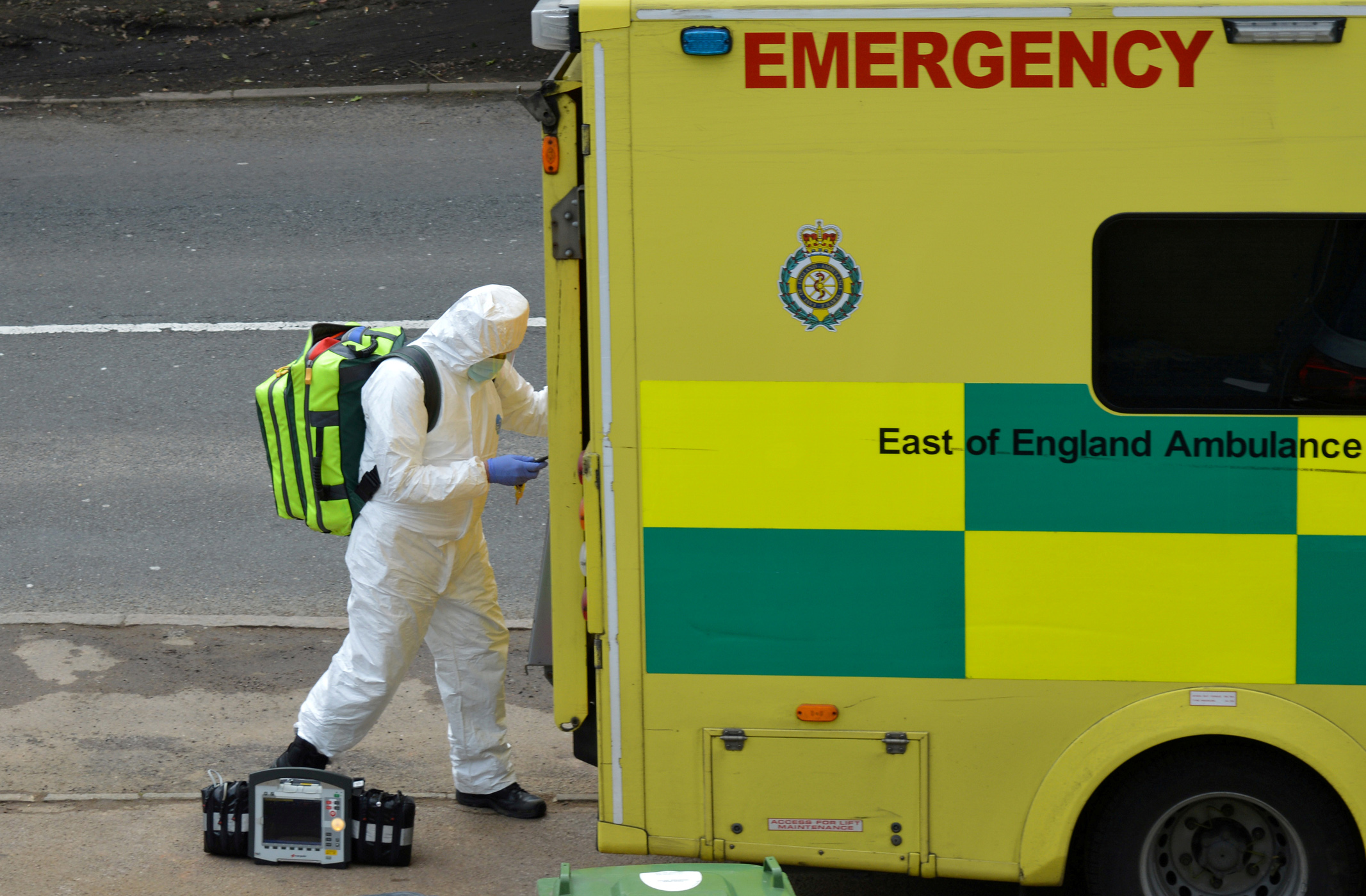 FILE PHOTO: A paramedic is seen in Cheshunt at the back of an ambulance as the spread of the coronavirus disease (COVID-19) continues. in Cheshunt, Britain March 20, 2020. REUTERS