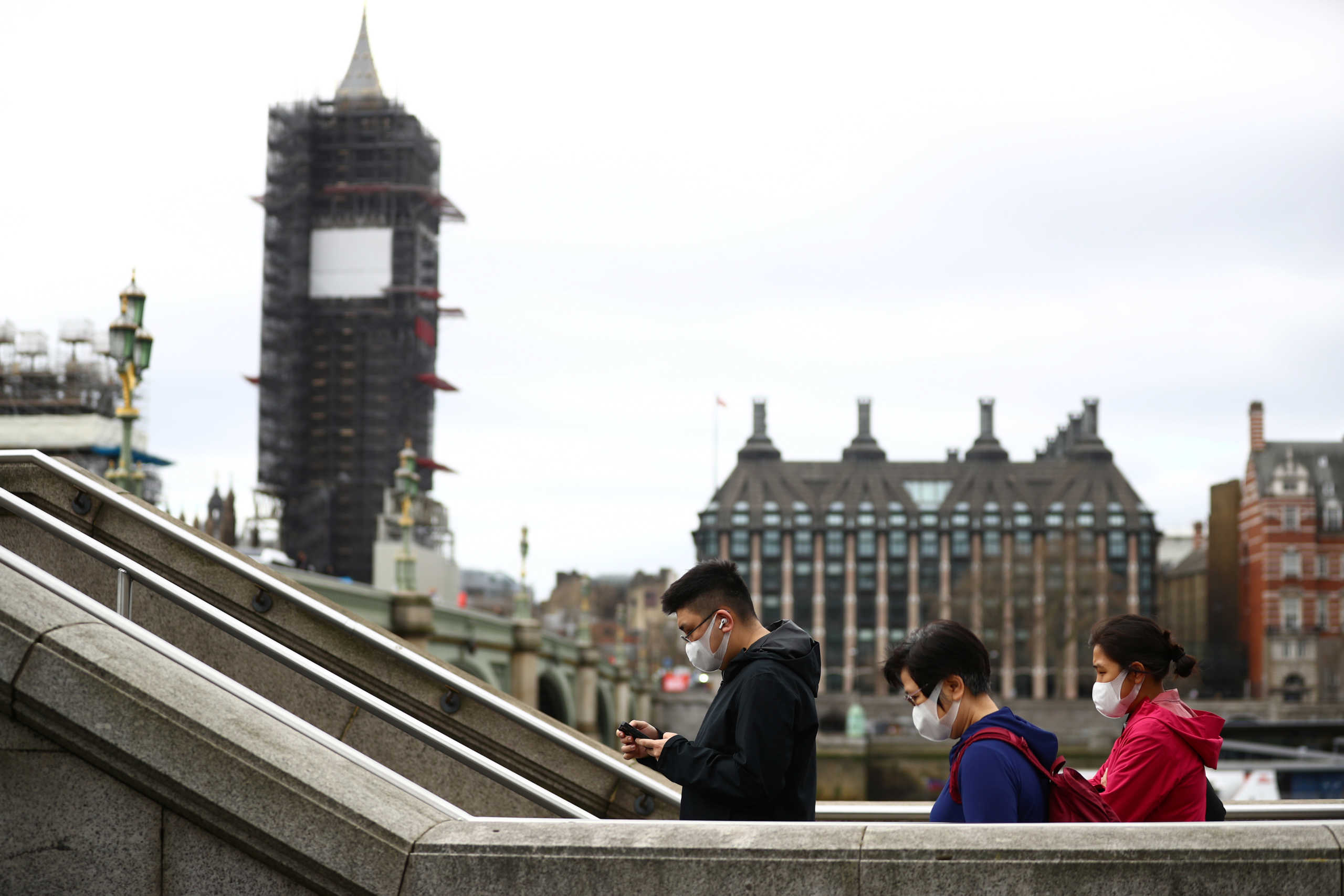 People wearing protective face masks in Westminster as the number of coronavirus cases grow around the world. London, Britain, March 17, 2020. REUTERS