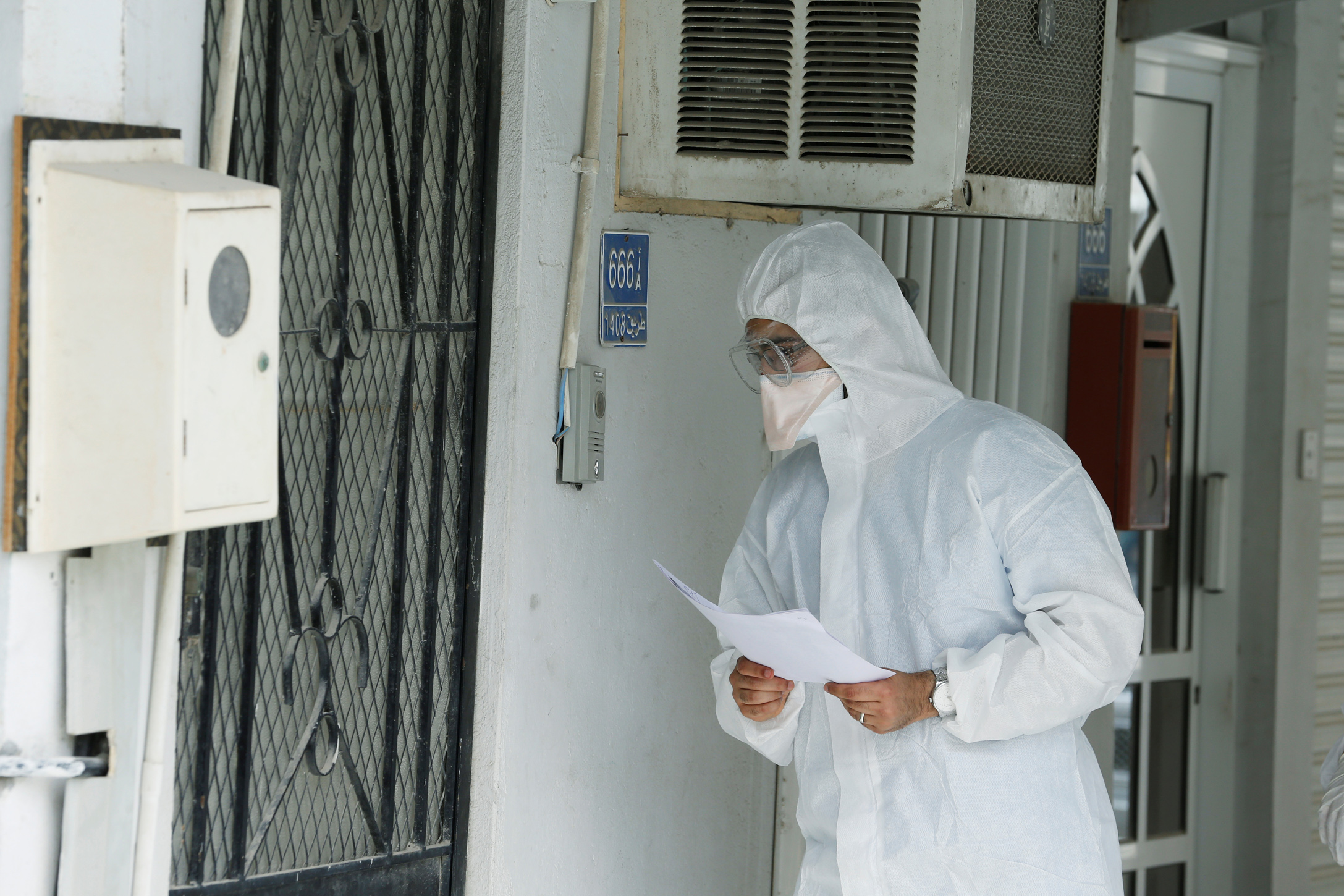 Doctors call a traveler who returned from Iran at their residency, to check if is infected with the novel coronavirus, at Isa Town Health Center, south of Manama, Bahrain, March 2, 2020. REUTERS