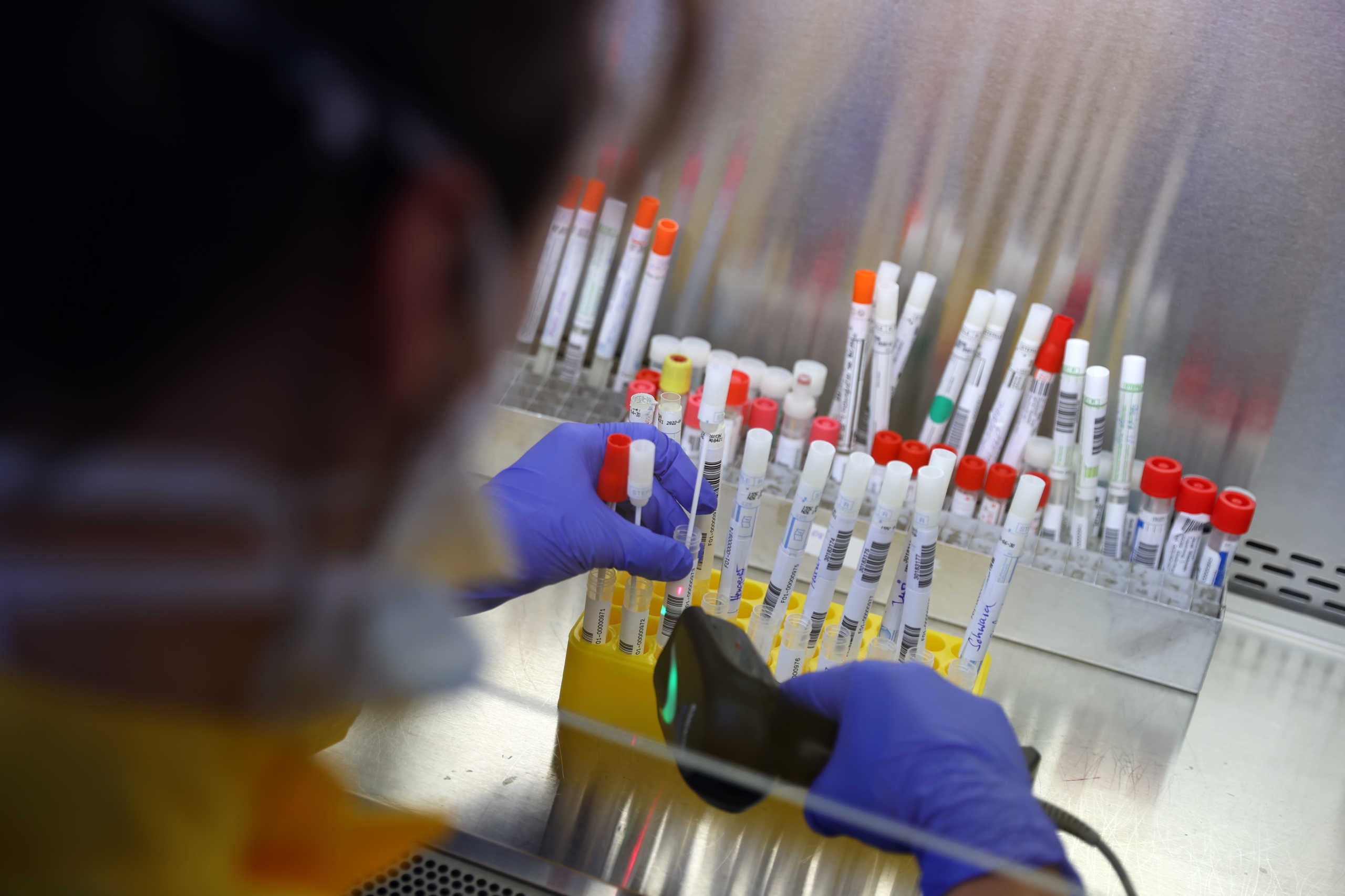 An employee in protective clothing does a fast test for coronavirus, developed by Frankfurt's University Clinic and the German Red Cross, that will allow to increase the testing rate per day significant, as the spread of the coronavirus disease (COVID-19) continues, in Frankfurt, Germany, March 31, 2020. REUTERS
