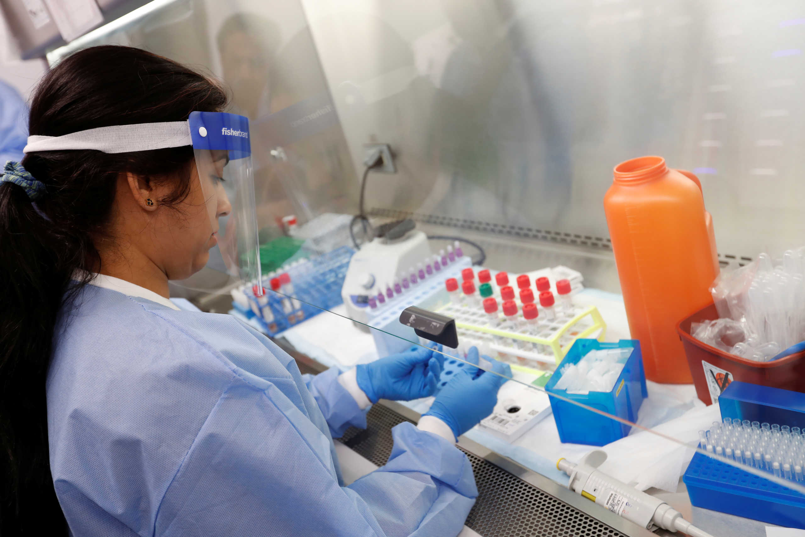 A medical technologist tests a respiratory panel at Northwell Health Labs, where the same test will be used on the COVID-19, the disease caused by the novel coronavirus, after being authorized to begin semi-automated testing by the US Food and Drug Administration (FDA) in Lake Success, New York, U.S., March 11, 2020.   REUTERS