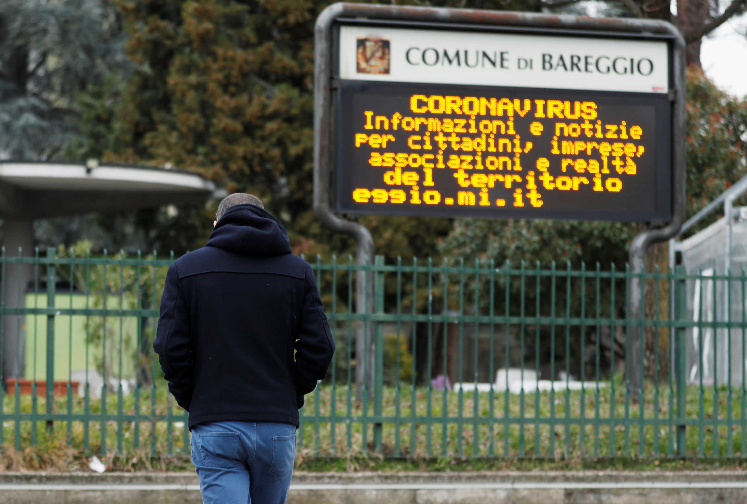 Schoolteacher Alessio Villarosa walks on a street in the small town of Bareggio near Milan, Italy February 29, 2020. Italian government has closed schools and universities in Lombardy and northern regions in order to prevent the spread of the highly infectious coronavirus. REUTERS