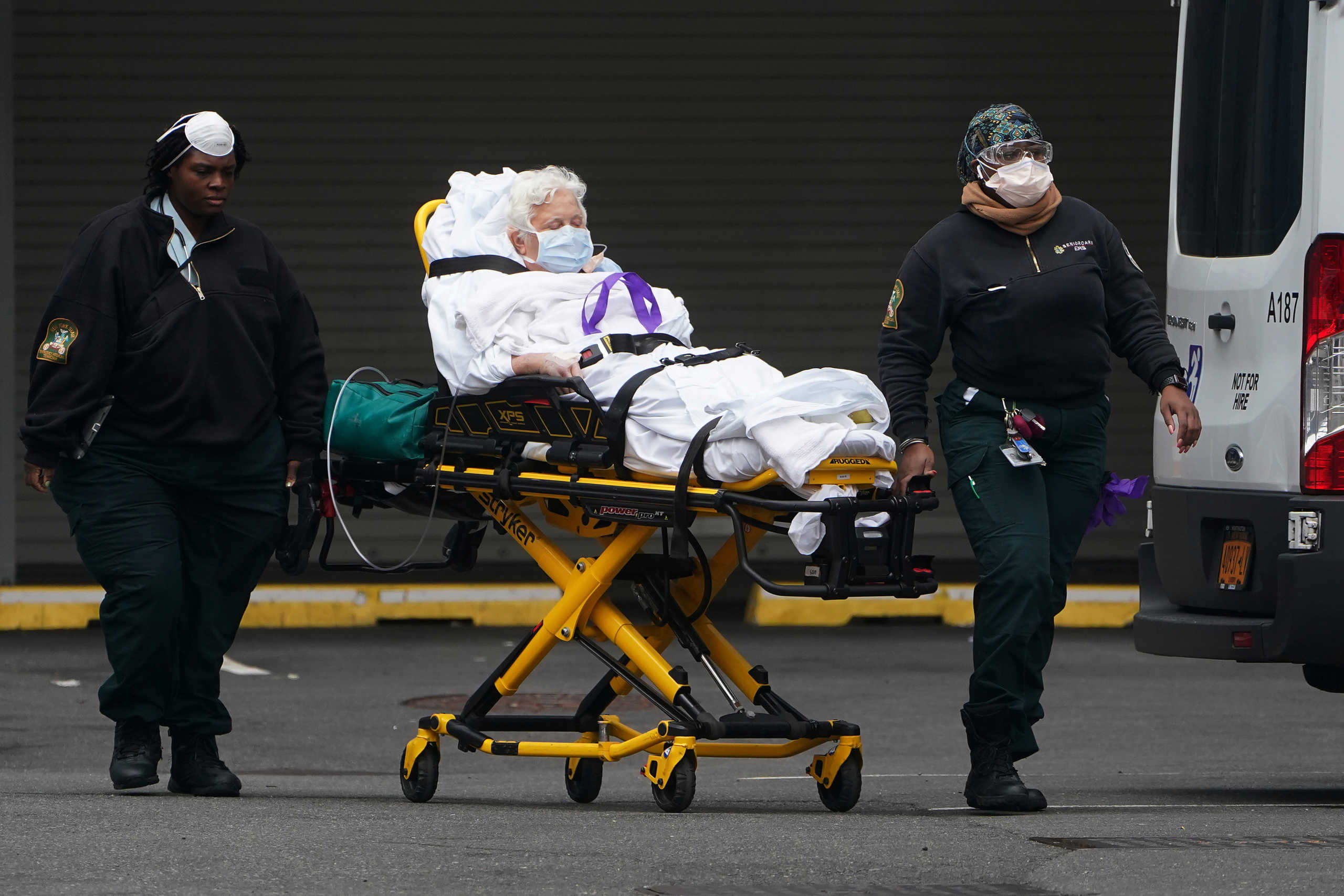 Paramedics move a patient into the hospital during the outbreak of coronavirus disease (COVID-19), in the Manhattan borough of New York City, New York, U.S., March 25, 2020. REUTERS