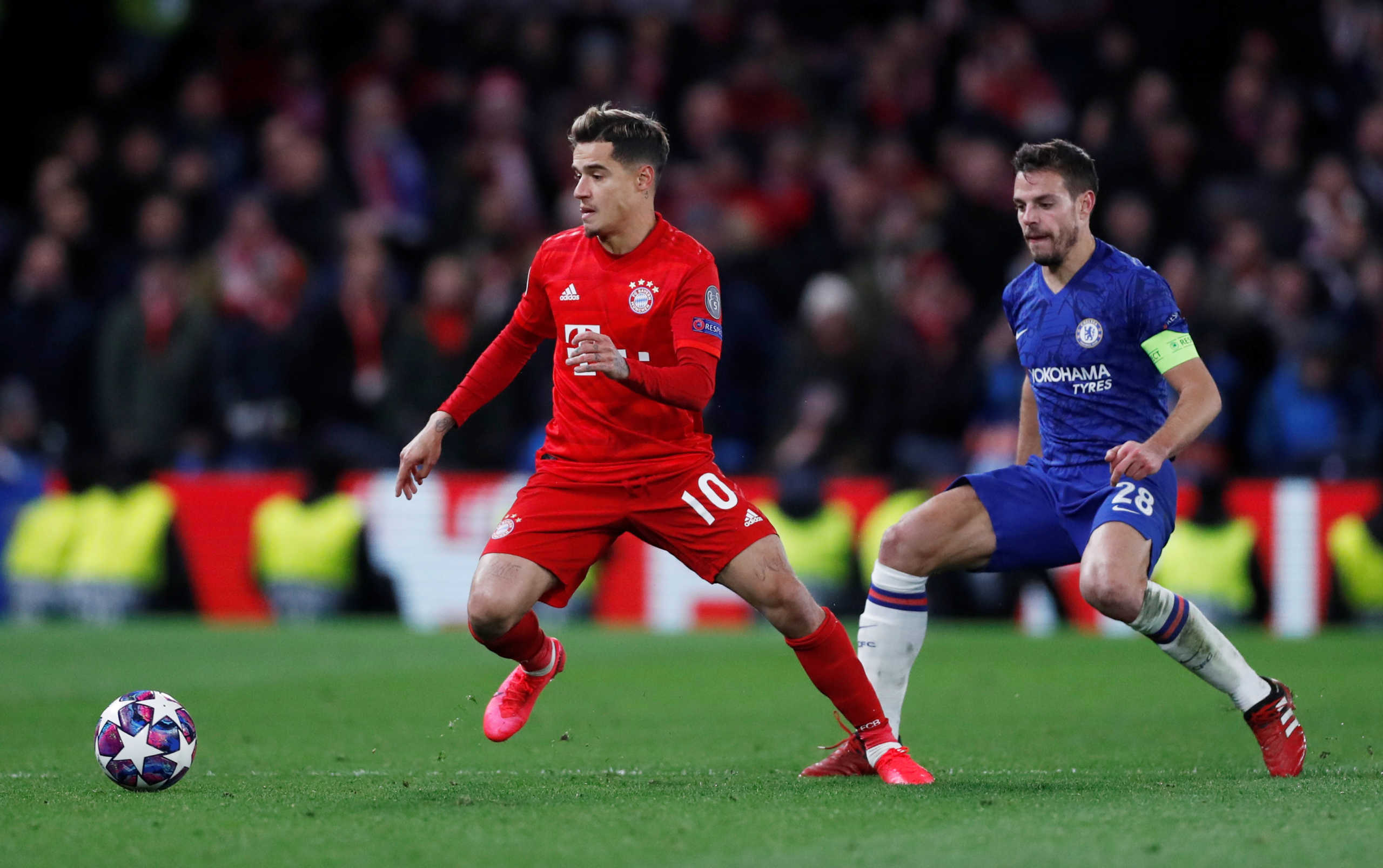 Soccer Football - Champions League - Round of 16 First Leg - Chelsea v Bayern Munich - Stamford Bridge, London, Britain - February 25, 2020  Bayern Munich's Philippe Coutinho in action with Chelsea's Cesar Azpilicueta   Action Images via Reuters