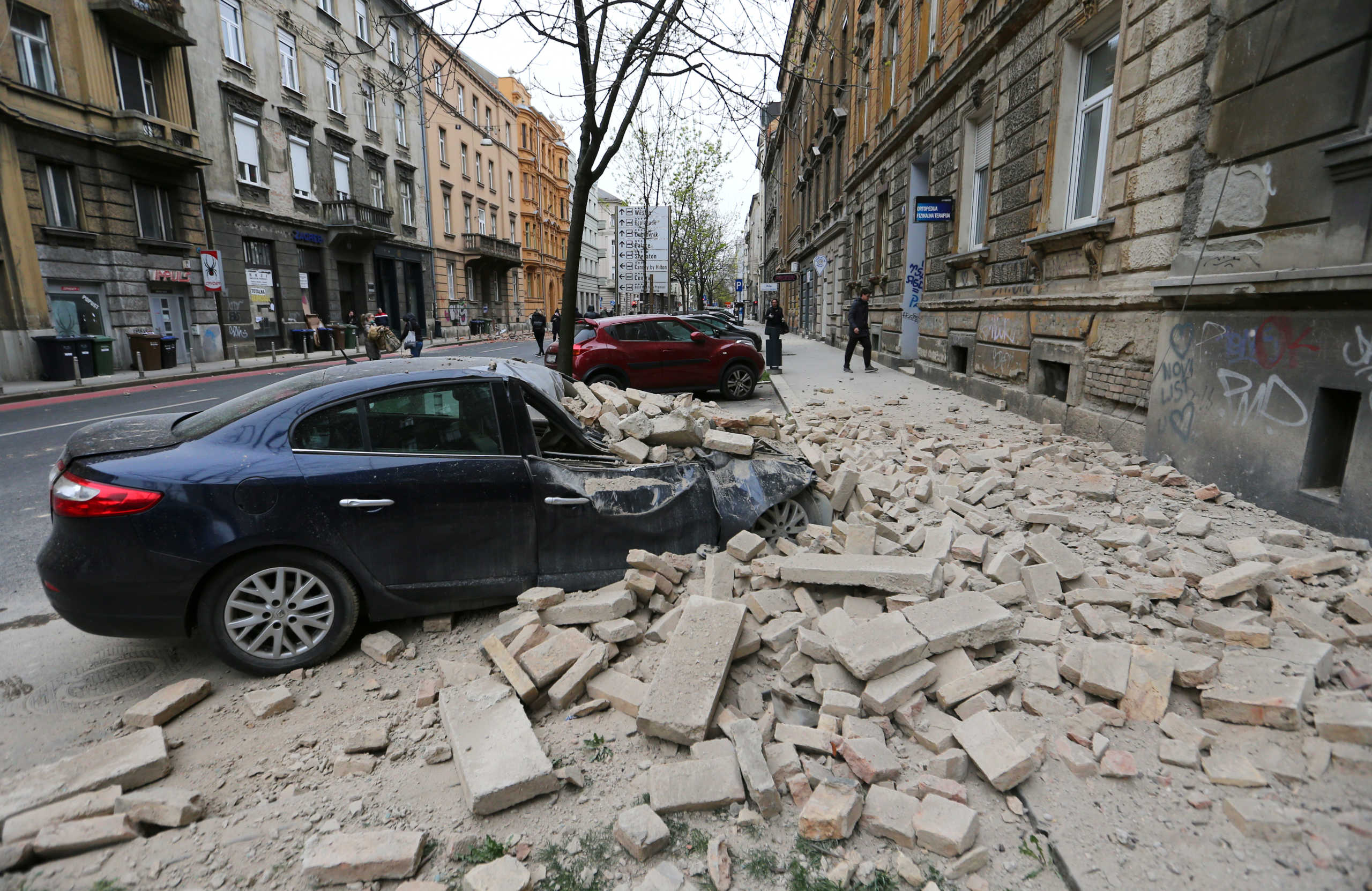 A damaged car is seen following an earthquake, in Zagreb, Croatia March 22, 2020. REUTERS