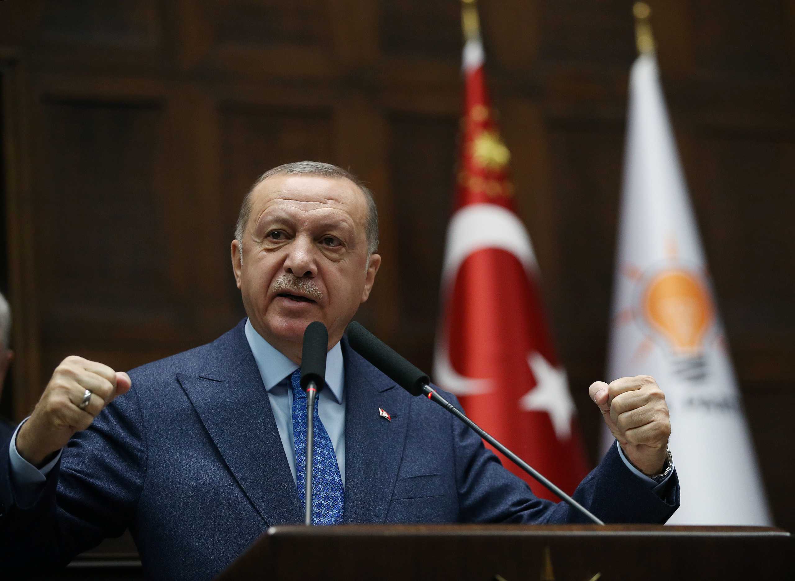 Turkish President Tayyip Erdogan addresses members of his ruling AK Party during a meeting at the parliament in Ankara, Turkey, March 11, 2020. Presidential Press Office