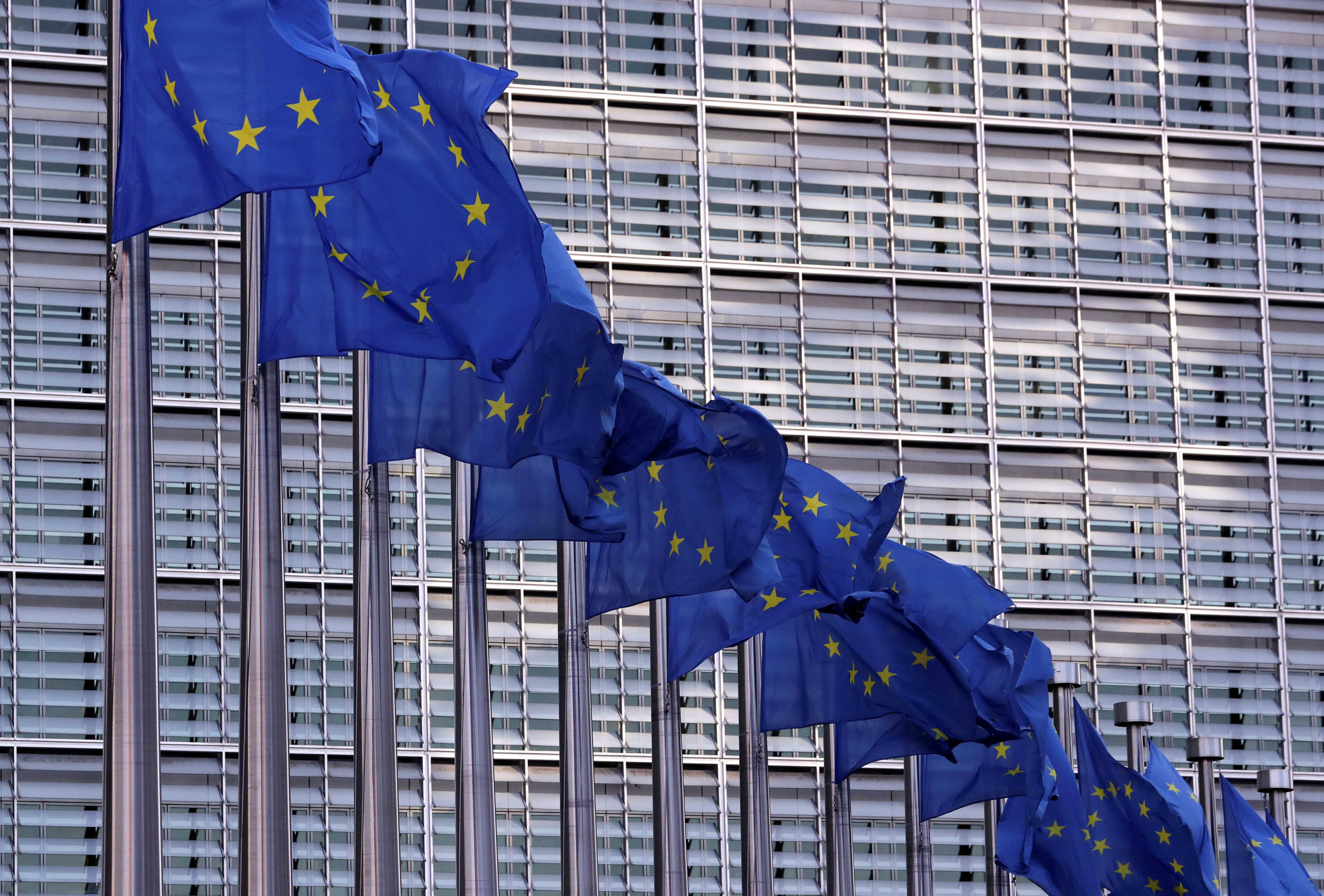 FILE PHOTO: European Union flags fly outside the European Commission headquarters in Brussels, Belgium, February 19, 2020. Picture taken February 19, 2020 REUTERS