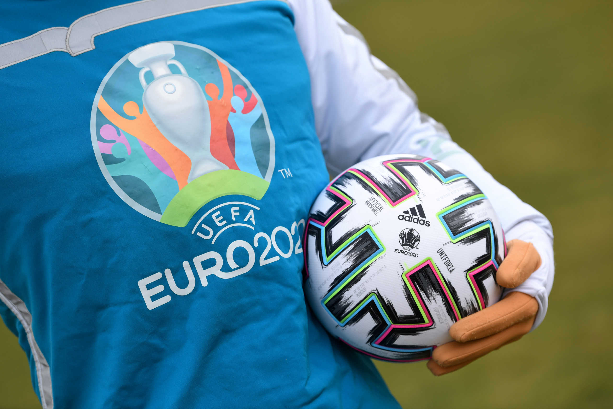 FILE PHOTO: UEFA Euro 2020 mascot Skillzy poses for a photo with the official match ball at Olympiapark in Munich, Germany, March 3, 2020. REUTERS