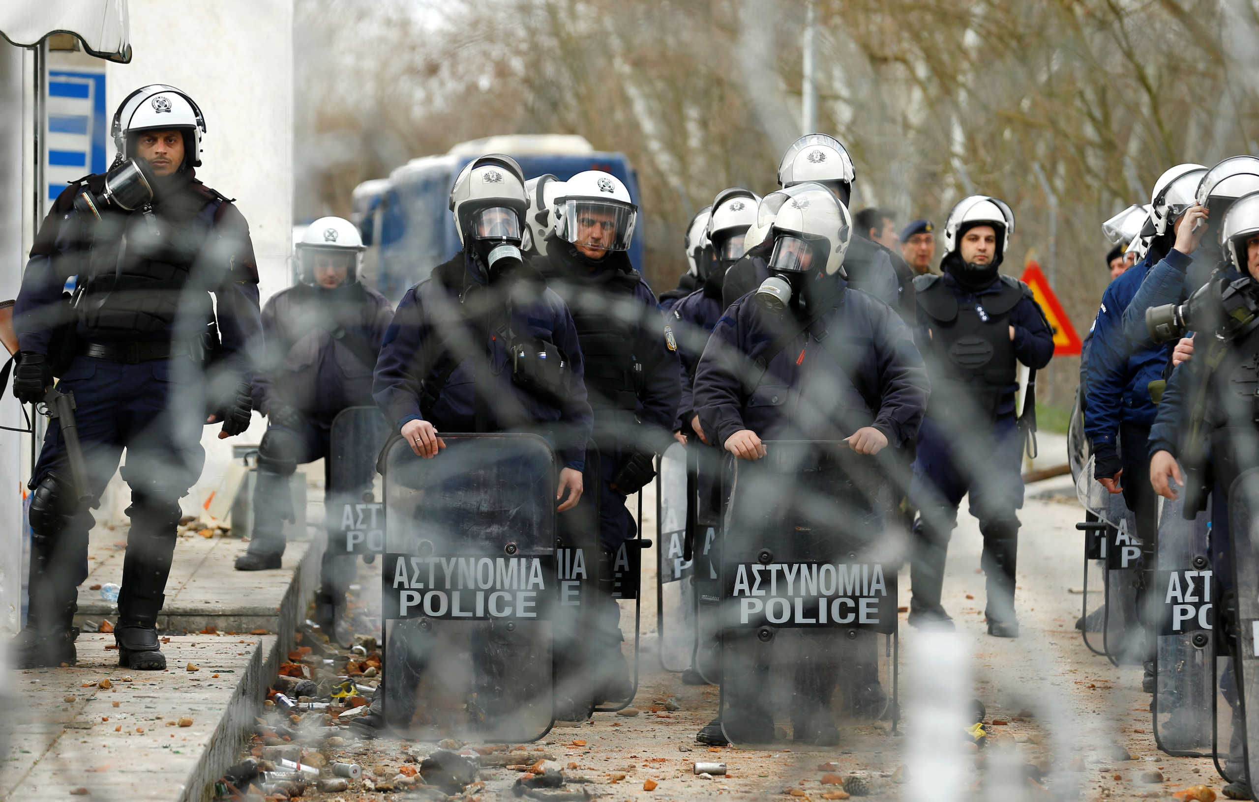 Greek police officers are pictured from Turkey's Pazarkule border crossing with Greece's Kastanies, in Edirne, Turkey, February 29, 2020. REUTERS