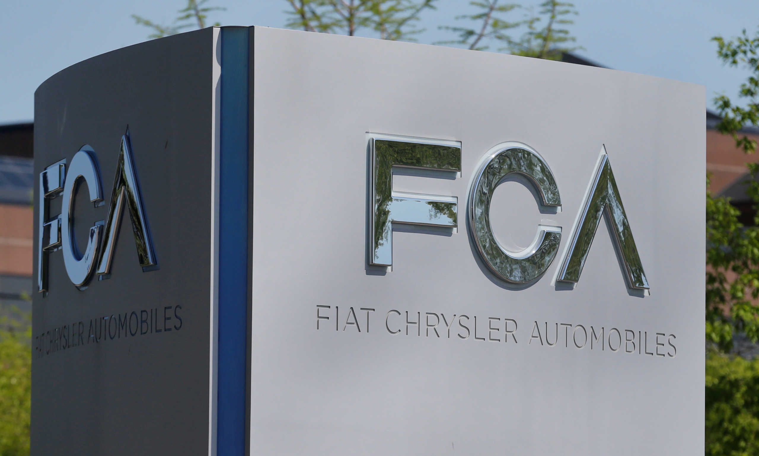 FILE PHOTO: A Fiat Chrysler Automobiles (FCA) sign is at the U.S. headquarters in Auburn Hills, Michigan, U.S. May 25, 2018.  REUTERS