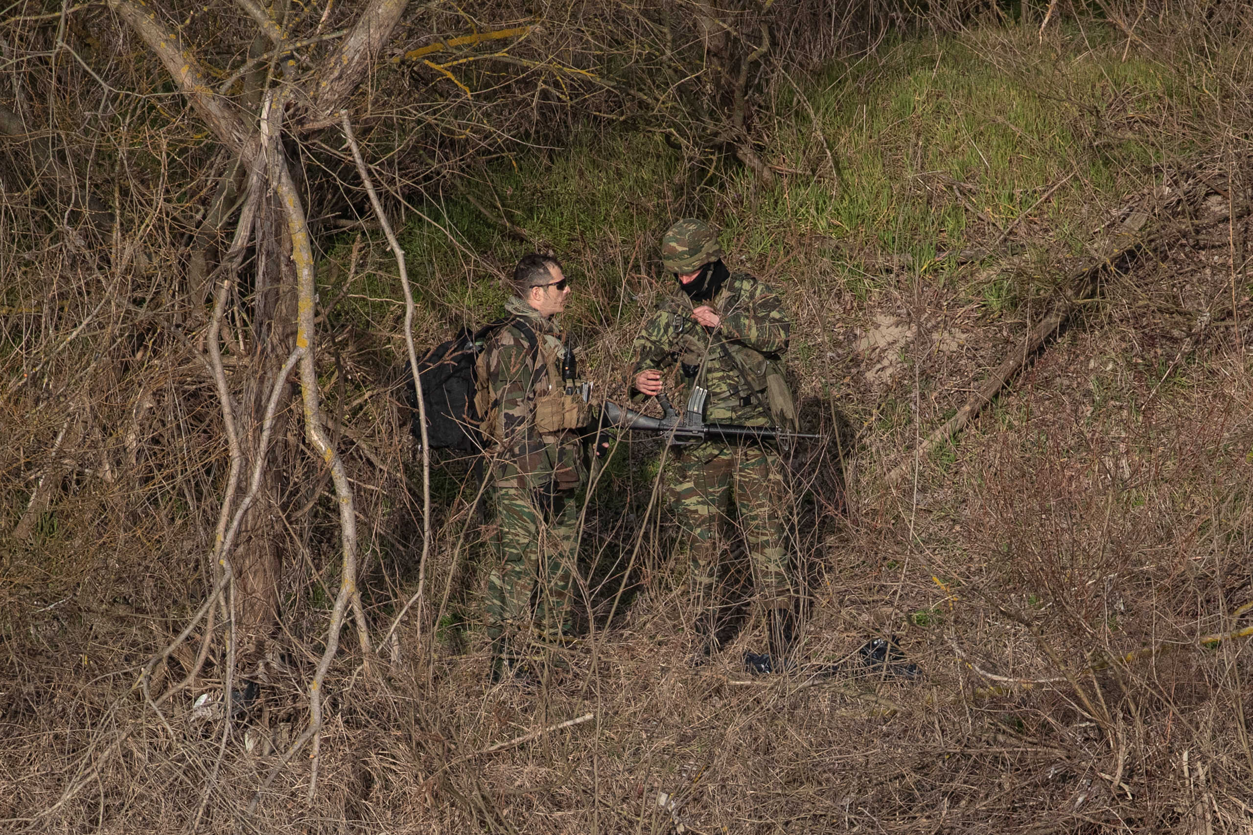 Greek soldiers patrol on the banks of Evros river, natural border between Turkey and Greece, pictured from Turkey's side near Edirne, Turkey, March 3, 2020. REUTERS