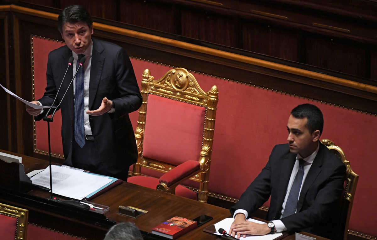 Italian Prime Minister Giuseppe Conte, standing next to Foreign Minister Luigi Di Maio, addresses the Senate, the upper house of parliament, on the spread of coronavirus disease (COVID-19), in Rome, Italy, March 26, 2020 REUTERS