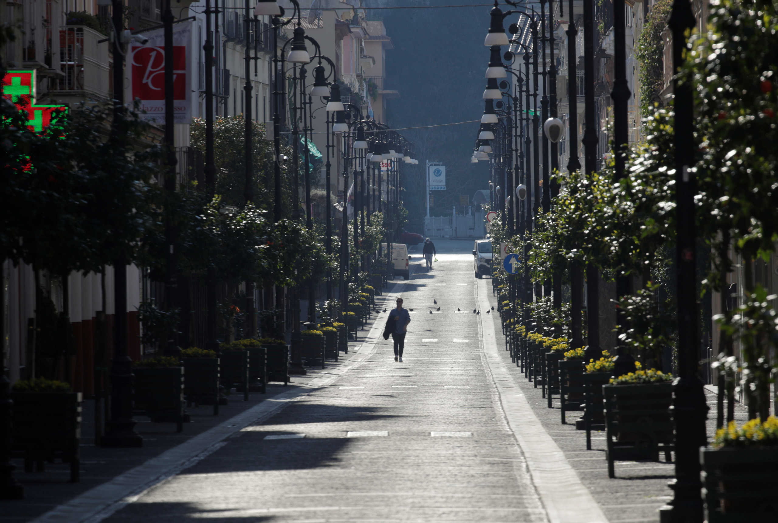 General view of a man in a street in Sorrento as Italy remains under a nationwide lockdown in a government decree that orders Italians to stay at home, in Sorrento, Italy, March 19, 2020. REUTERS