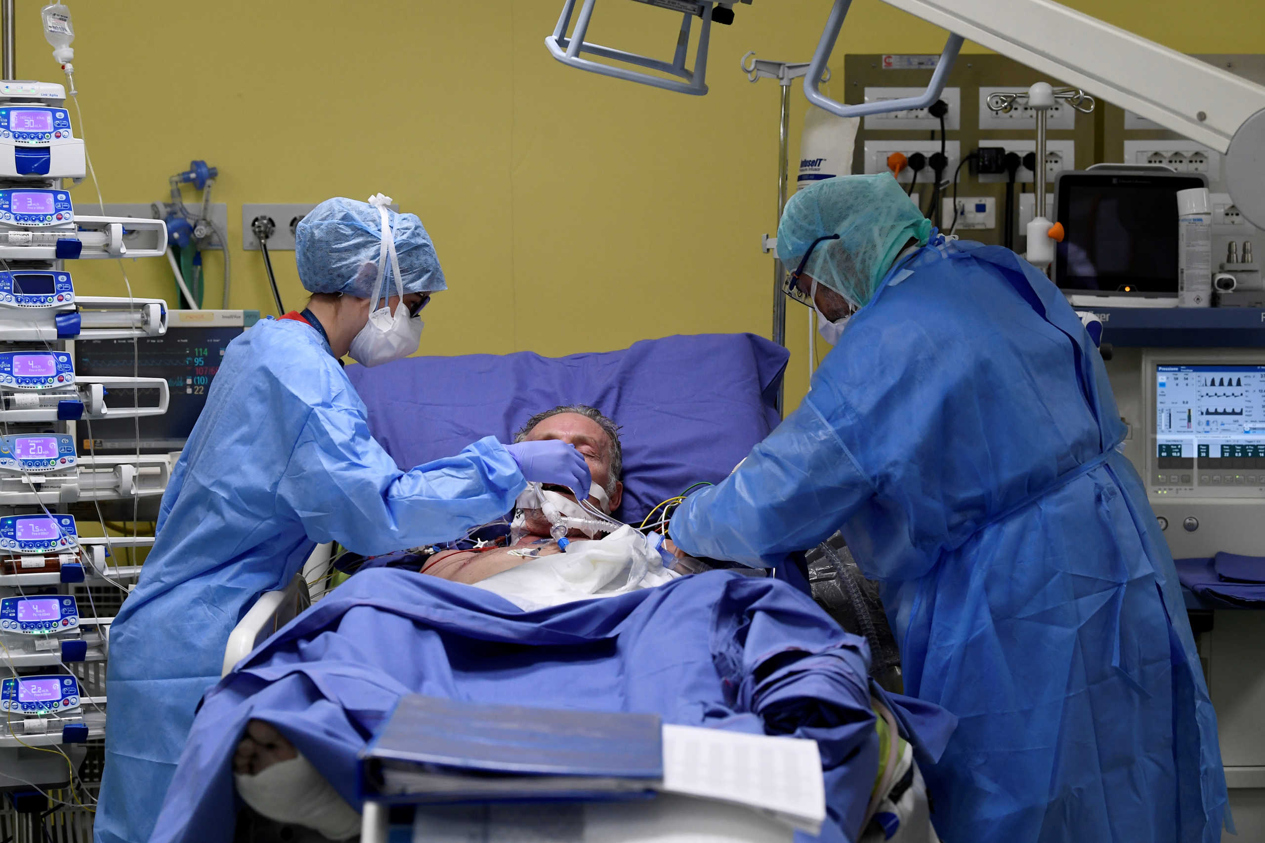 SENSITIVE MATERIAL. THIS IMAGE MAY OFFEND OR DISTURB Members of the medical staff in protective suits treat a patient suffering from coronavirus disease (COVID-19) in an intensive care unit at the San Raffaele hospital in Milan, Italy, March 27, 2020. REUTERS
