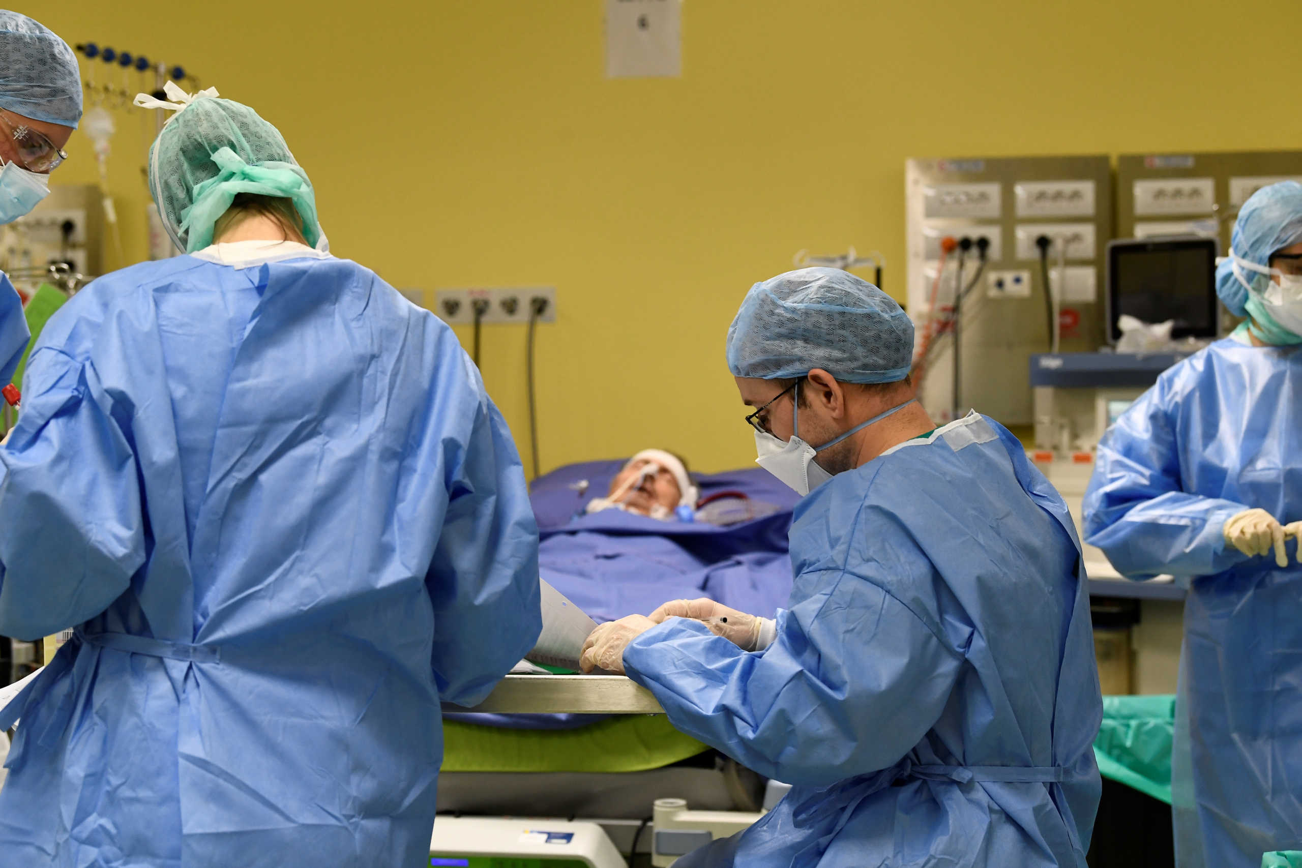 SENSITIVE MATERIAL. THIS IMAGE MAY OFFEND OR DISTURB Members of the medical staff in protective suits treat a patient suffering from coronavirus disease (COVID-19) in an intensive care unit at the San Raffaele hospital in Milan, Italy, March 27, 2020. REUTERS