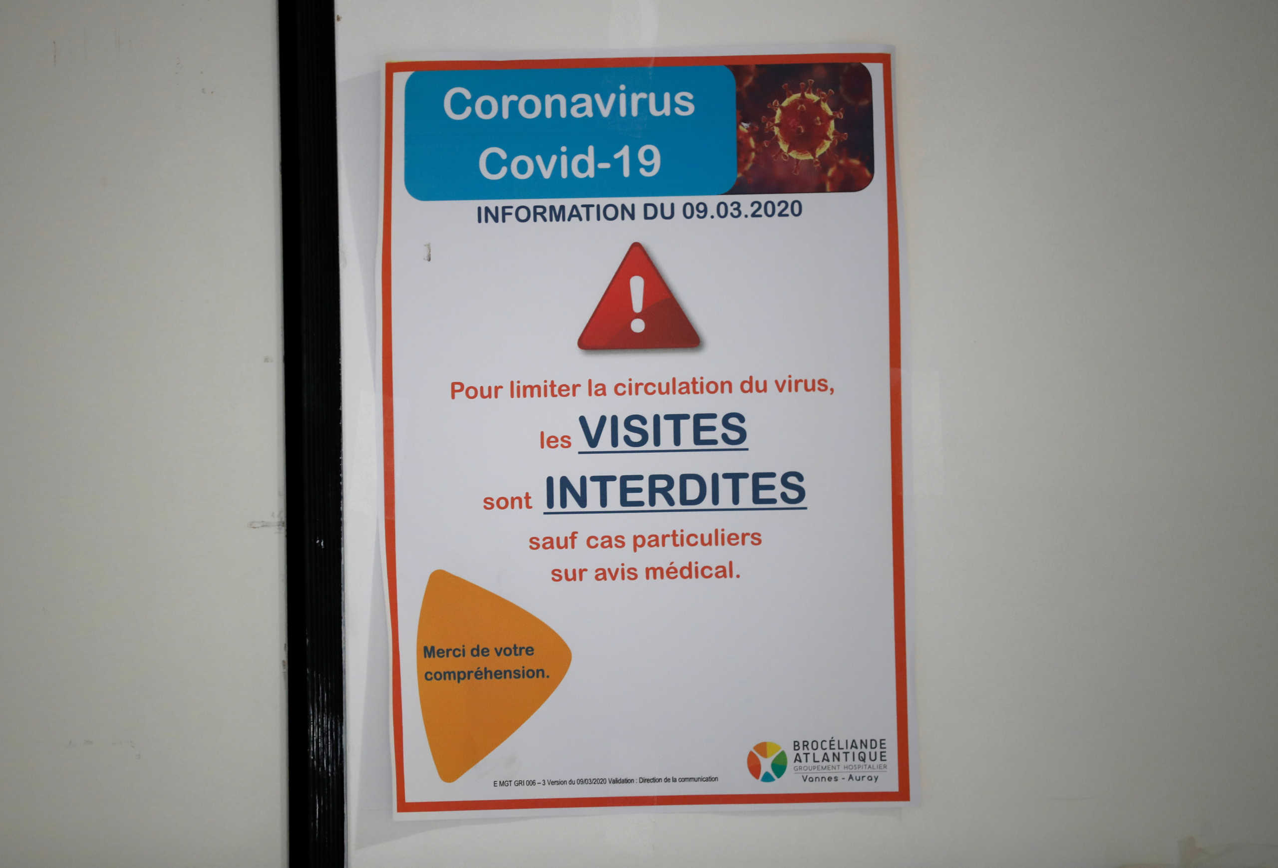 A no-access sign is seen on the door leading to the pulmonology unit at the hospital in Vannes where patients suffering from coronavirus disease (COVID-19) are treated, France, March 20, 2020. REUTERS